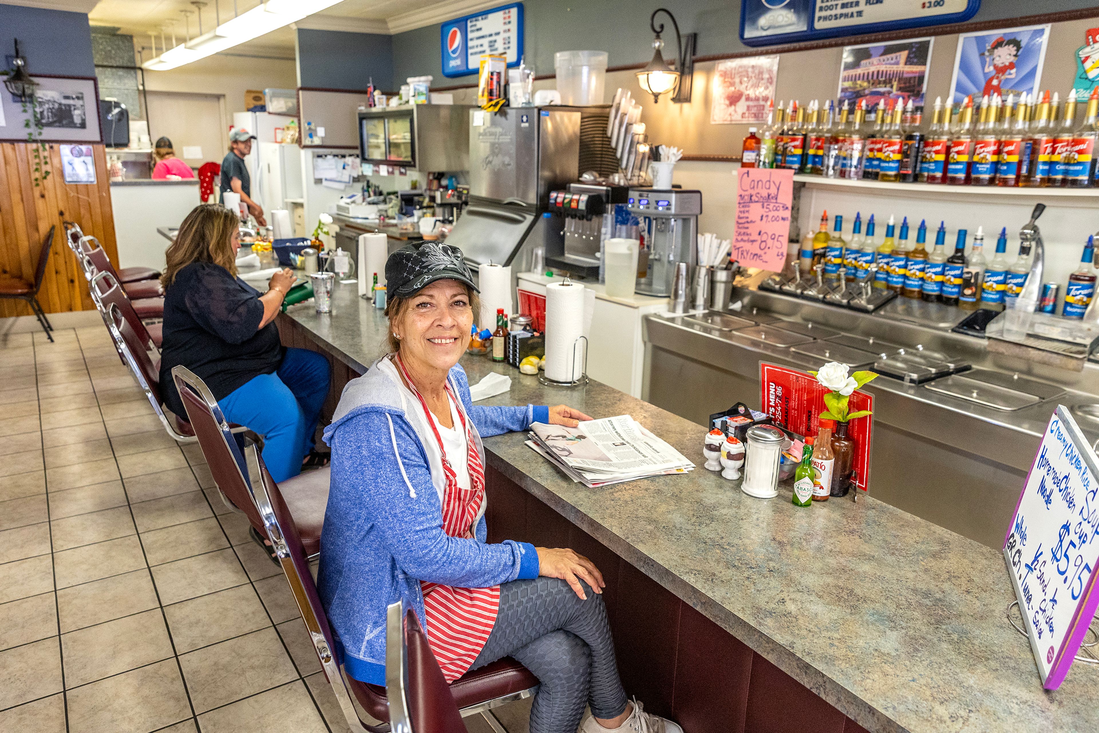 Tina LaFave sits at the counter for a portrait at the Wassem’s Coffee Shop Wednesday in Clarkston.