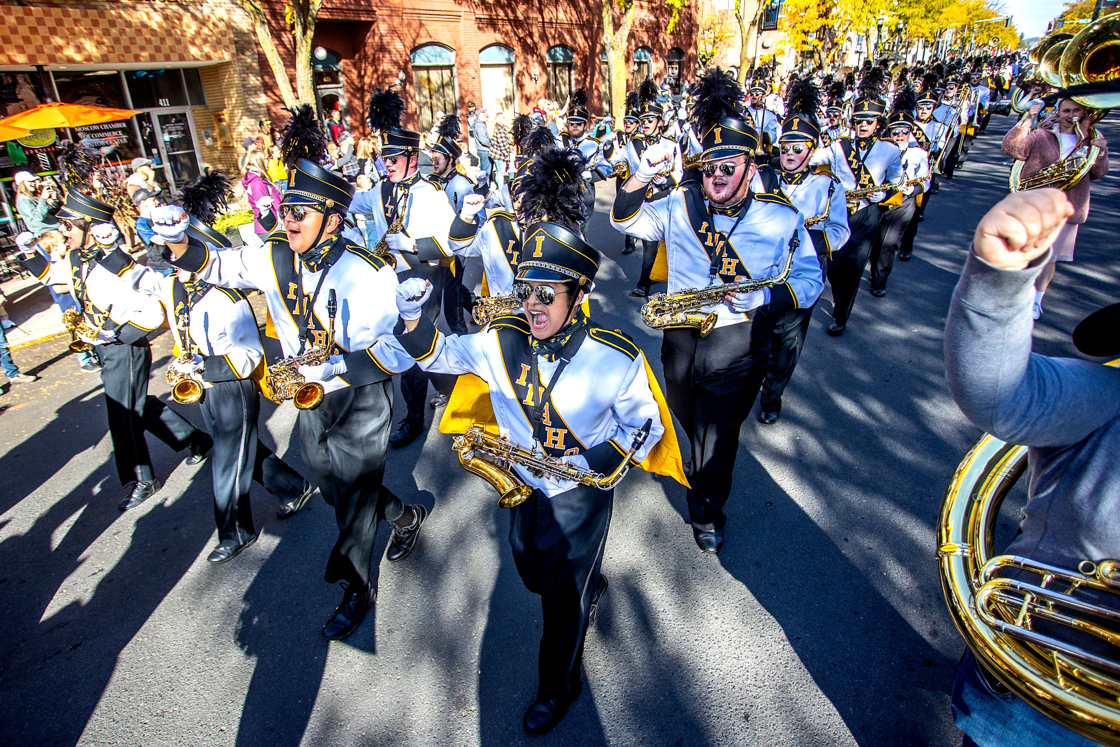 The University of Idaho’s Vandal Marching Band chants as they march along in the University of Idaho Homecoming Parade on Saturday in Moscow.