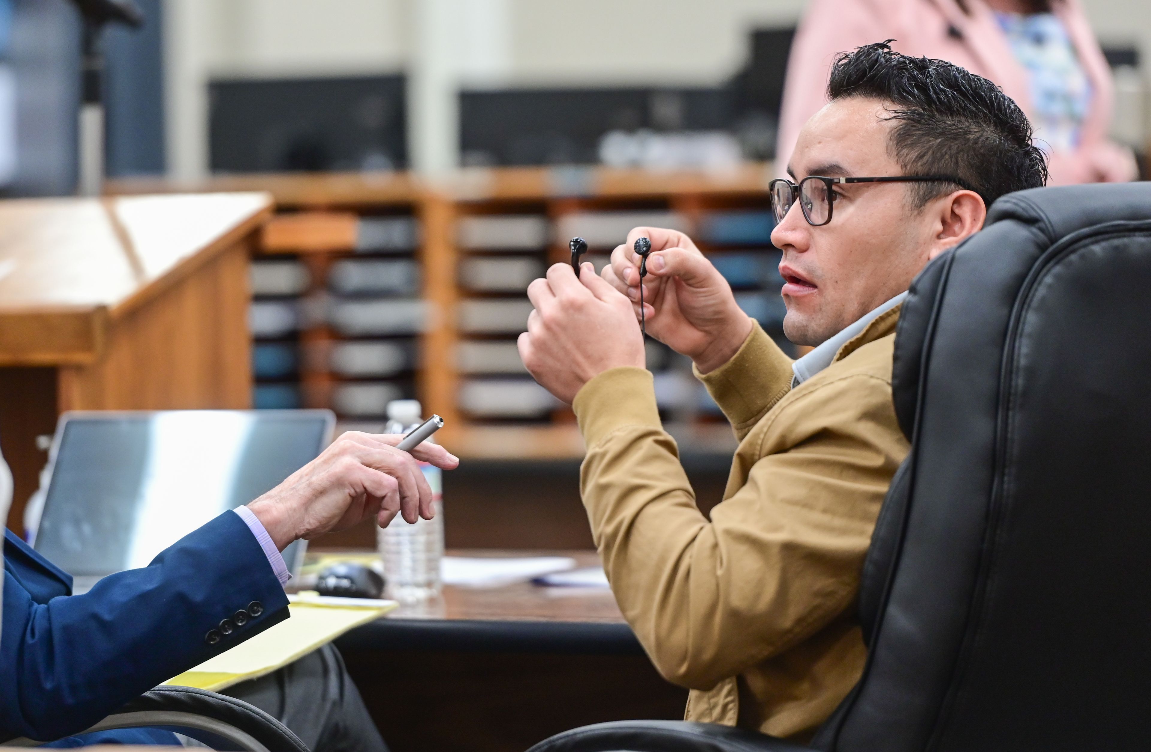 Juan Trejo Perez alerts the court that he cannot hear translators through his ear buds at the start of trial in Colfax on Tuesday, a problem which was solved with a change of batteries. A jury will choose whether to convict the 34-year-old Trejo Perez of felony third-degree child molestation.