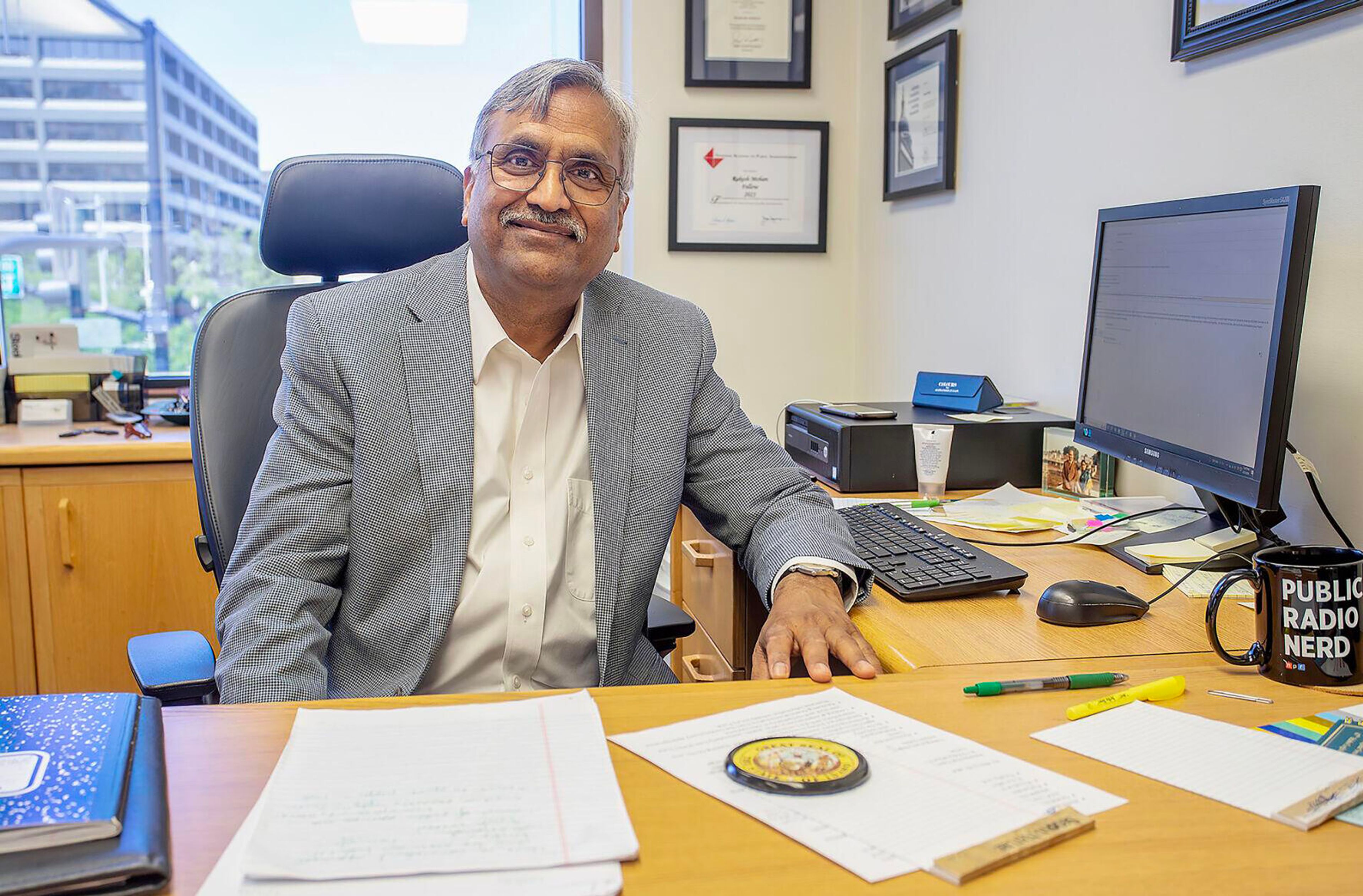 Retiring director of the Idaho Office of Performance Evaluations Rakesh Mohan poses for a portrait Monday in his office in downtown Boise.