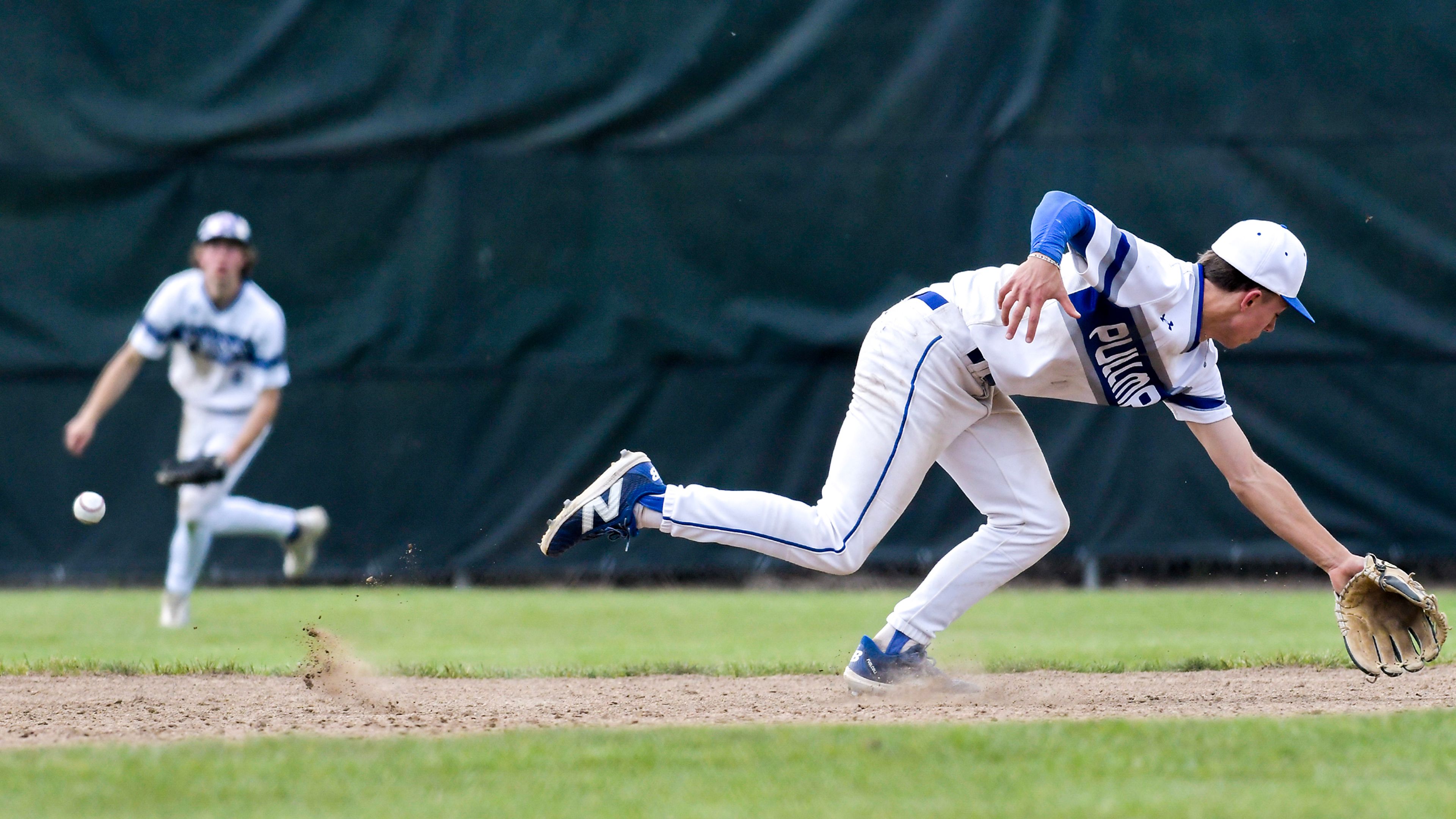 Pullman shortstop Brayden Randall misses a catch against Clarkston during a semifinal game of the district tournament Thursday in Pullman.