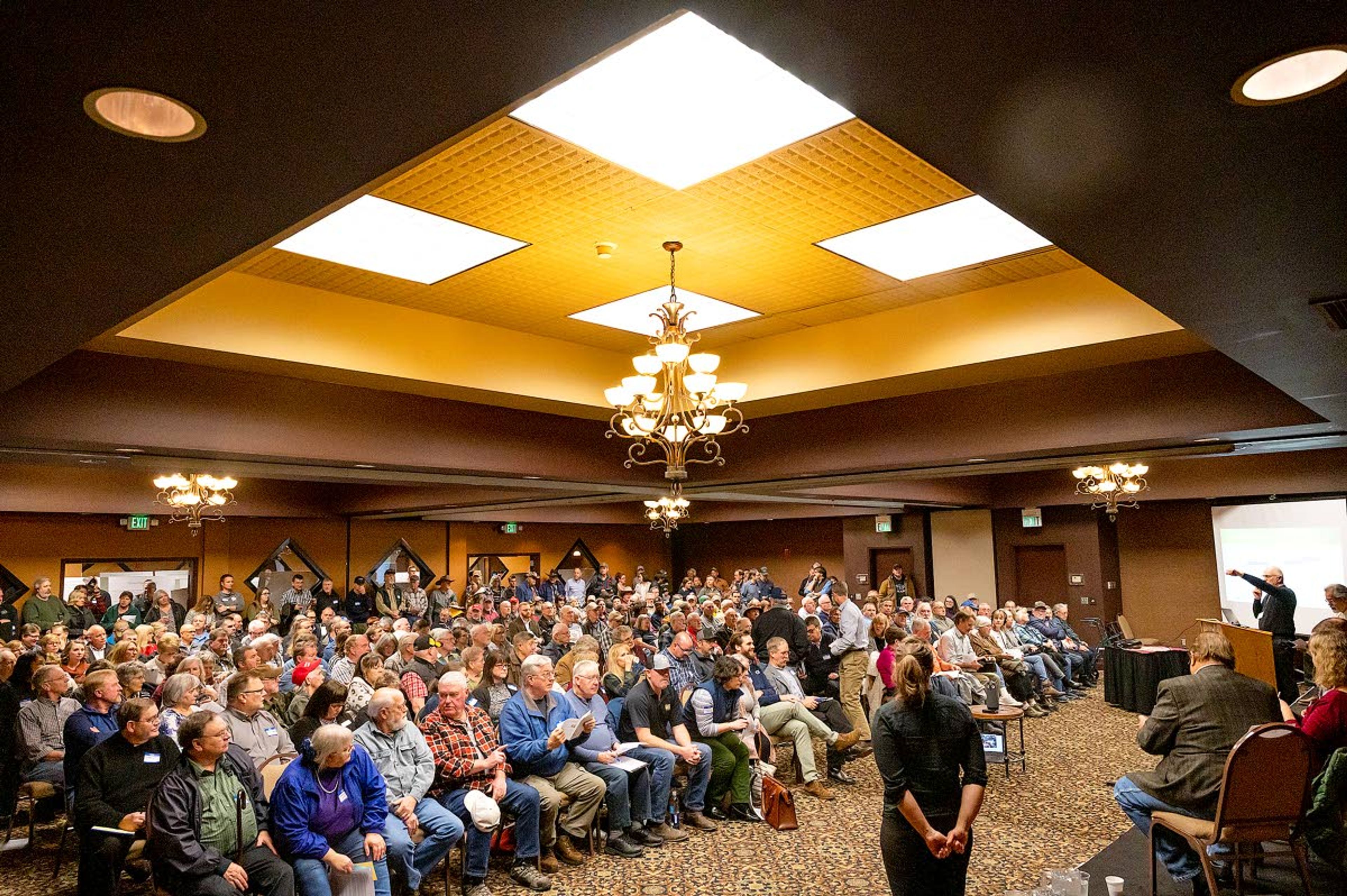 It was standing room only as Jim Kramer (far right) starting the meeting to cover the study commissioned by Washington Gov. Jay Inslee about the public opinion on the potential removal of the four lower Snake River dams Tuesday night at the conference center at the Quality Inn in Clarkston.