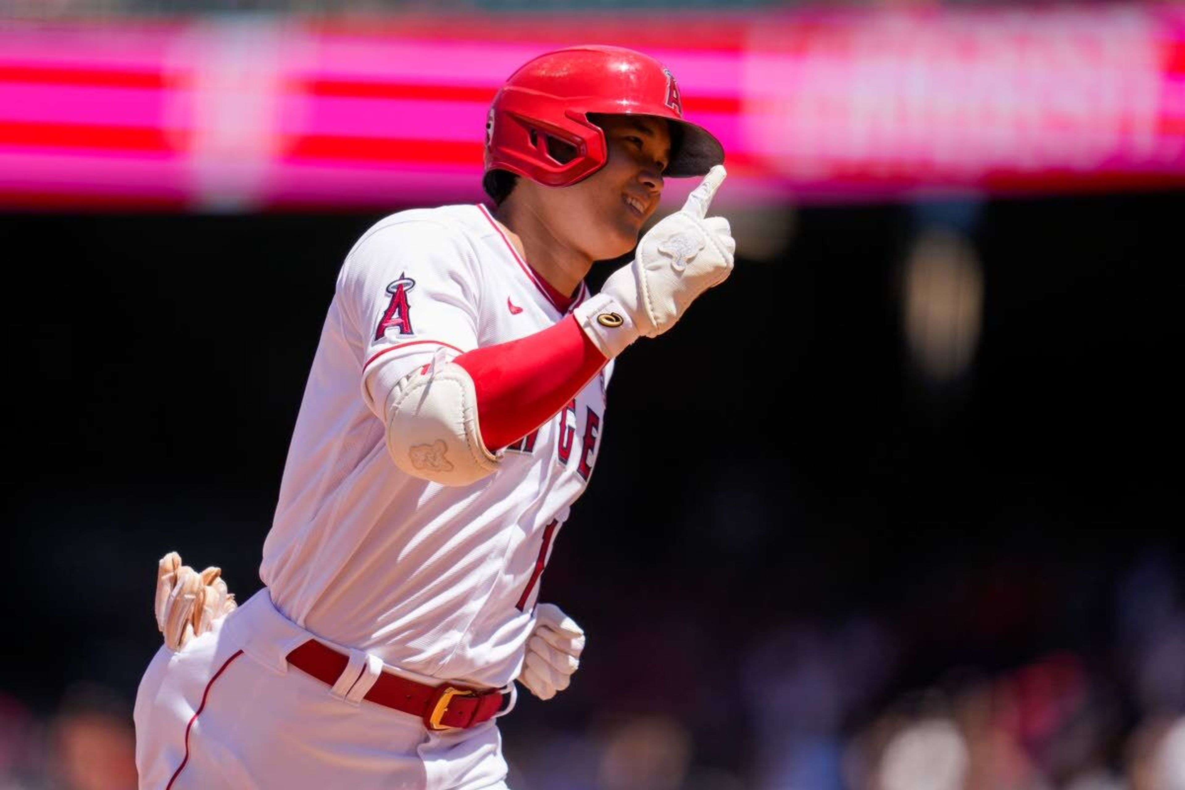 Los Angeles Angels designated hitter Shohei Ohtani (17) runs the bases after hitting a home run during the third inning of a baseball game against the Baltimore Orioles Sunday, July 4, 2021, in Anaheim, Calif. (AP Photo/Ashley Landis)