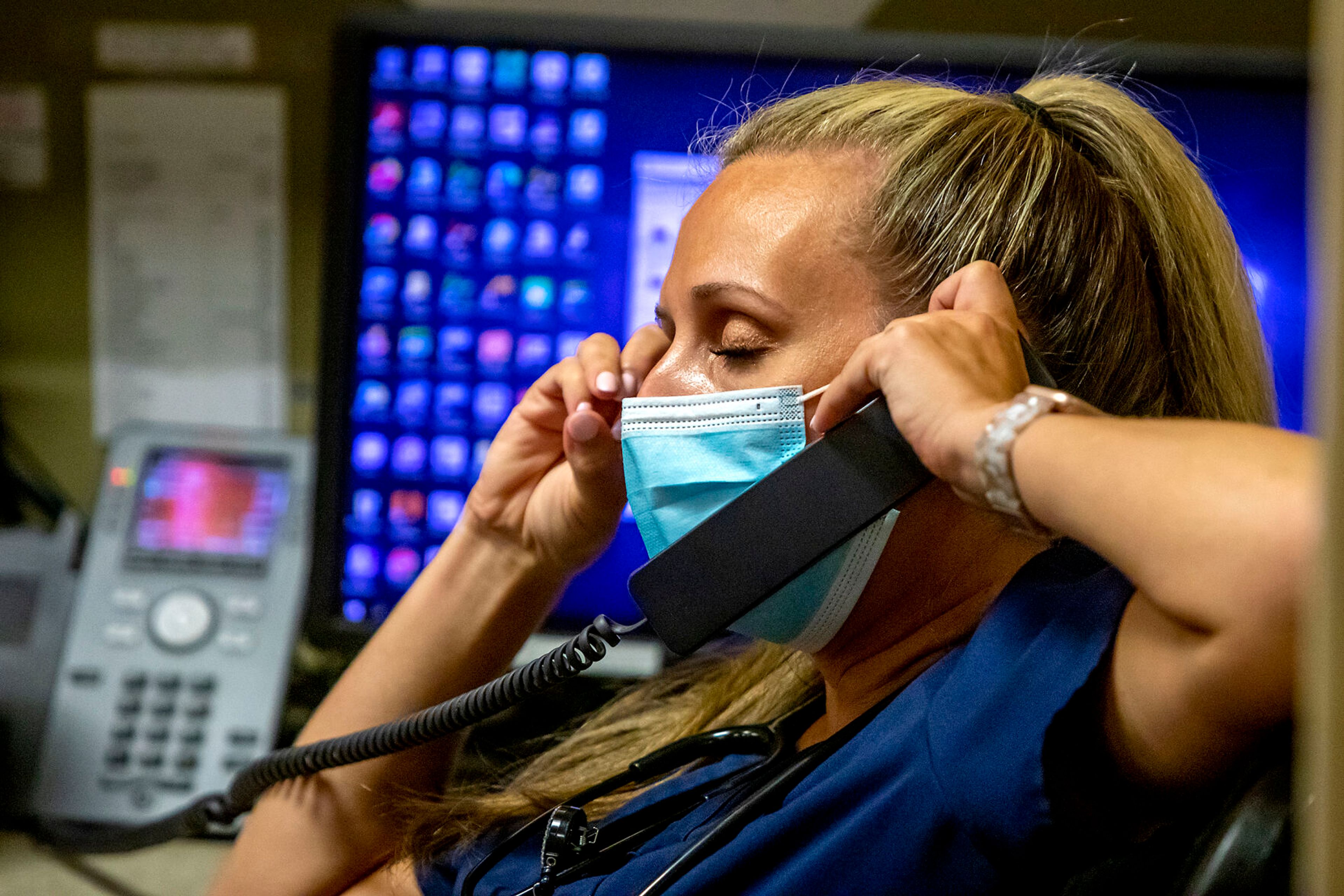 Kelsey Erwin talks on the phone while sitting at her computer at the Pullman Regional Hospital emergency room Sept. 24.