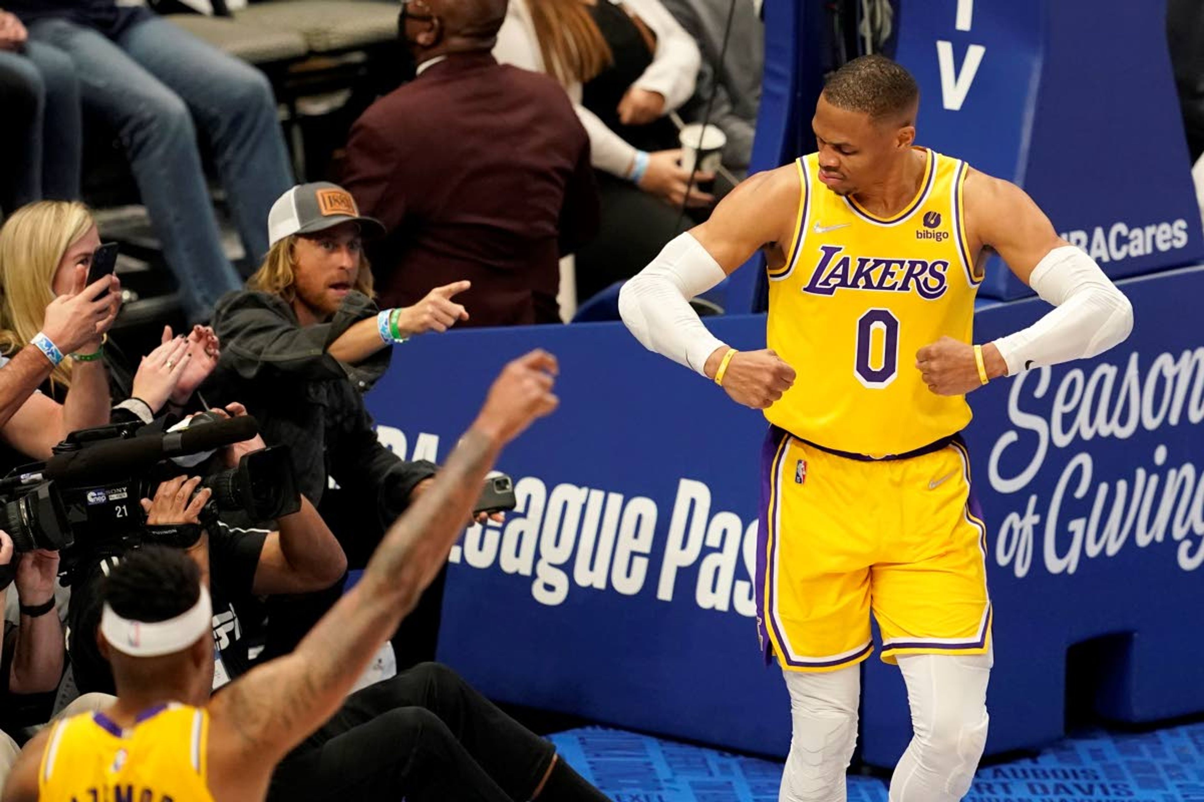 Lakers guard Russell Westbrook celebrates after sinking a basket as fans look on during a game Wednesday in Dallas.