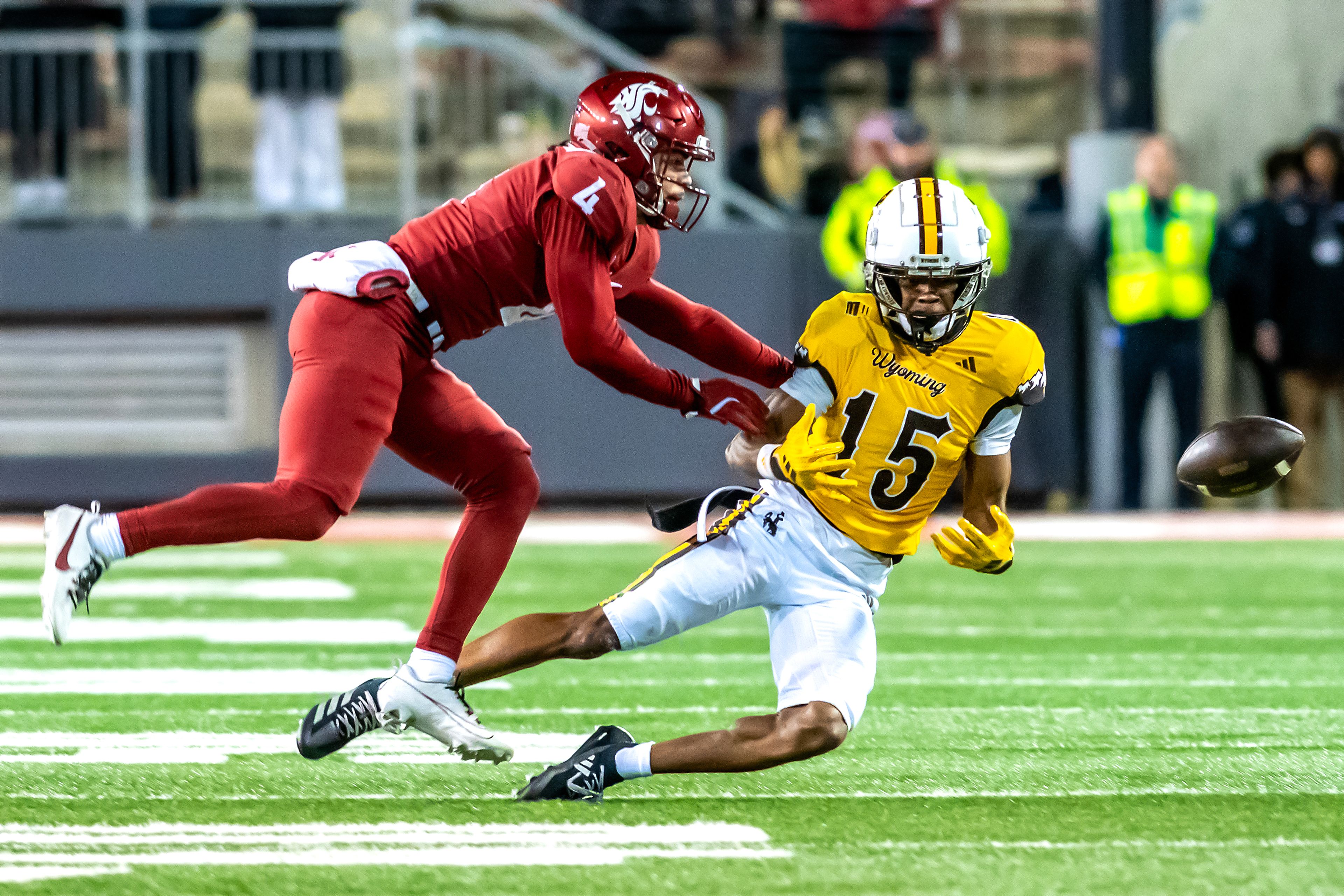 Wyoming wide receiver Chris Durr Jr. misses a catch as Washington State defensive back Kapena Gushiken breaks it up during a quarter of a college football game on Saturday, at Gesa Field in Pullman. Wyoming defeated Washington State 15-14.