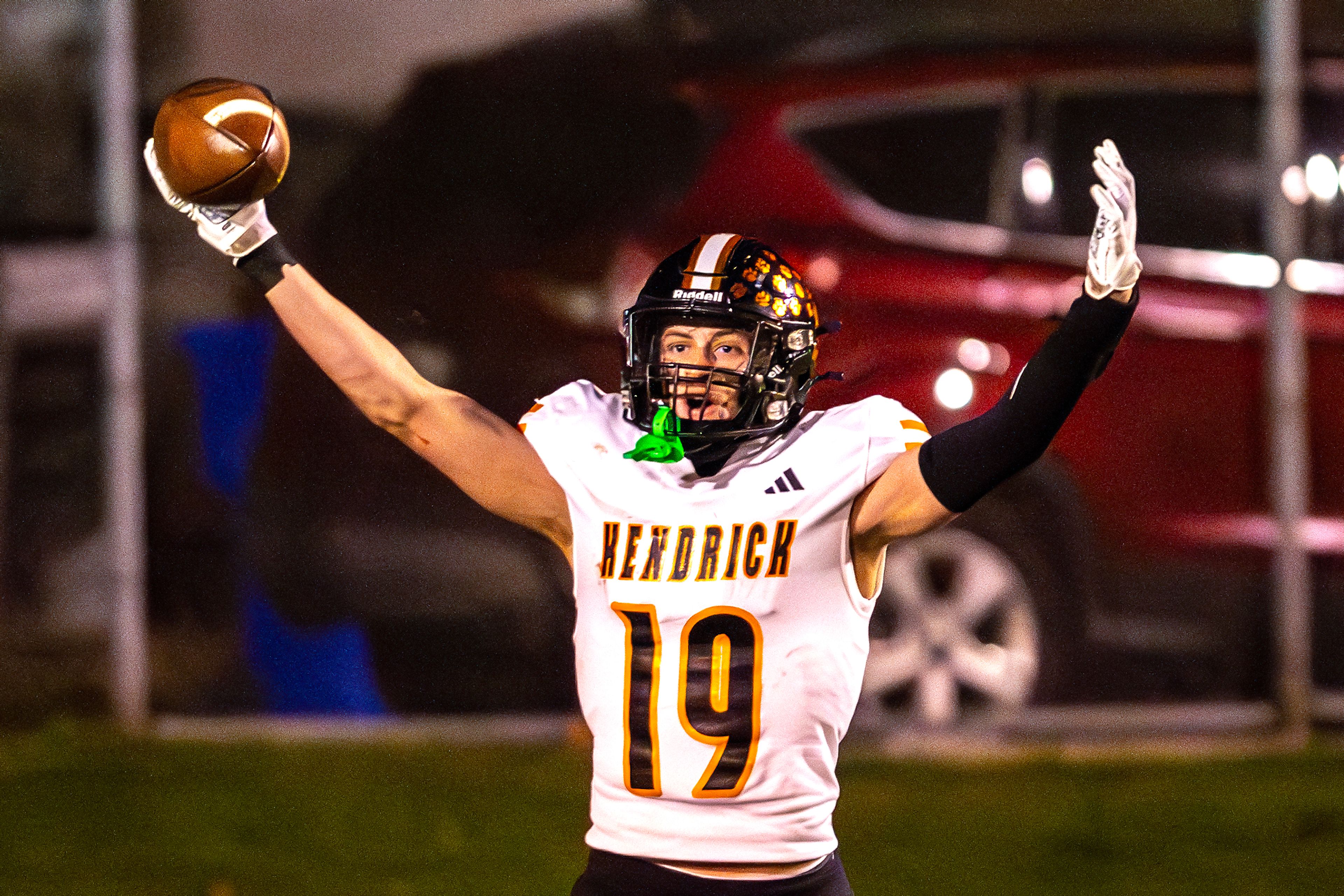 Kendrick running back Sawyer Hewett reacts after returning a kickoff for a touchdown against Logos in a semifinal game of the Idaho State Football Class 2A Championships Friday at Bengal Field in Lewiston.