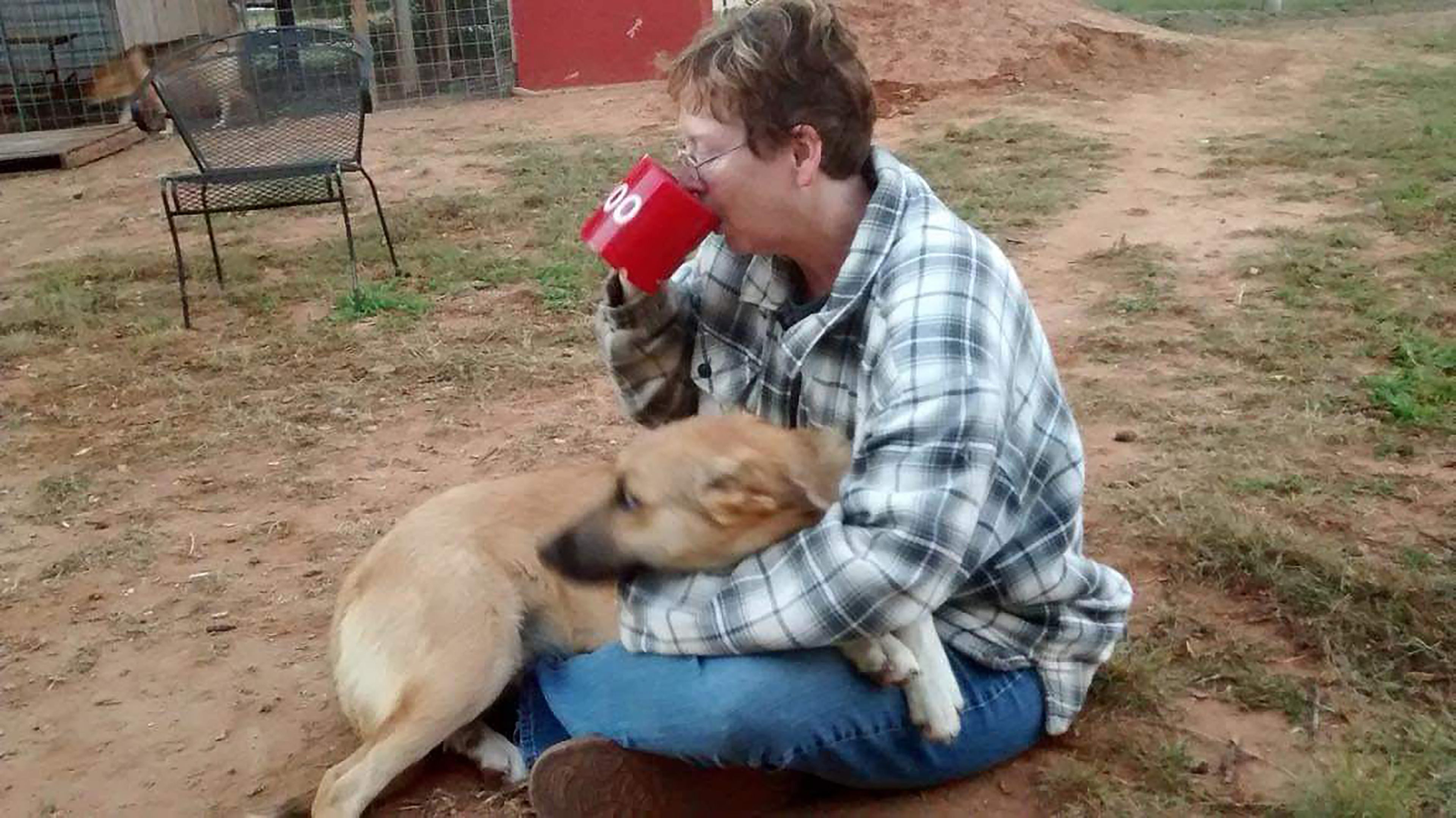 Patti Dobson at her home with one of her dogs.