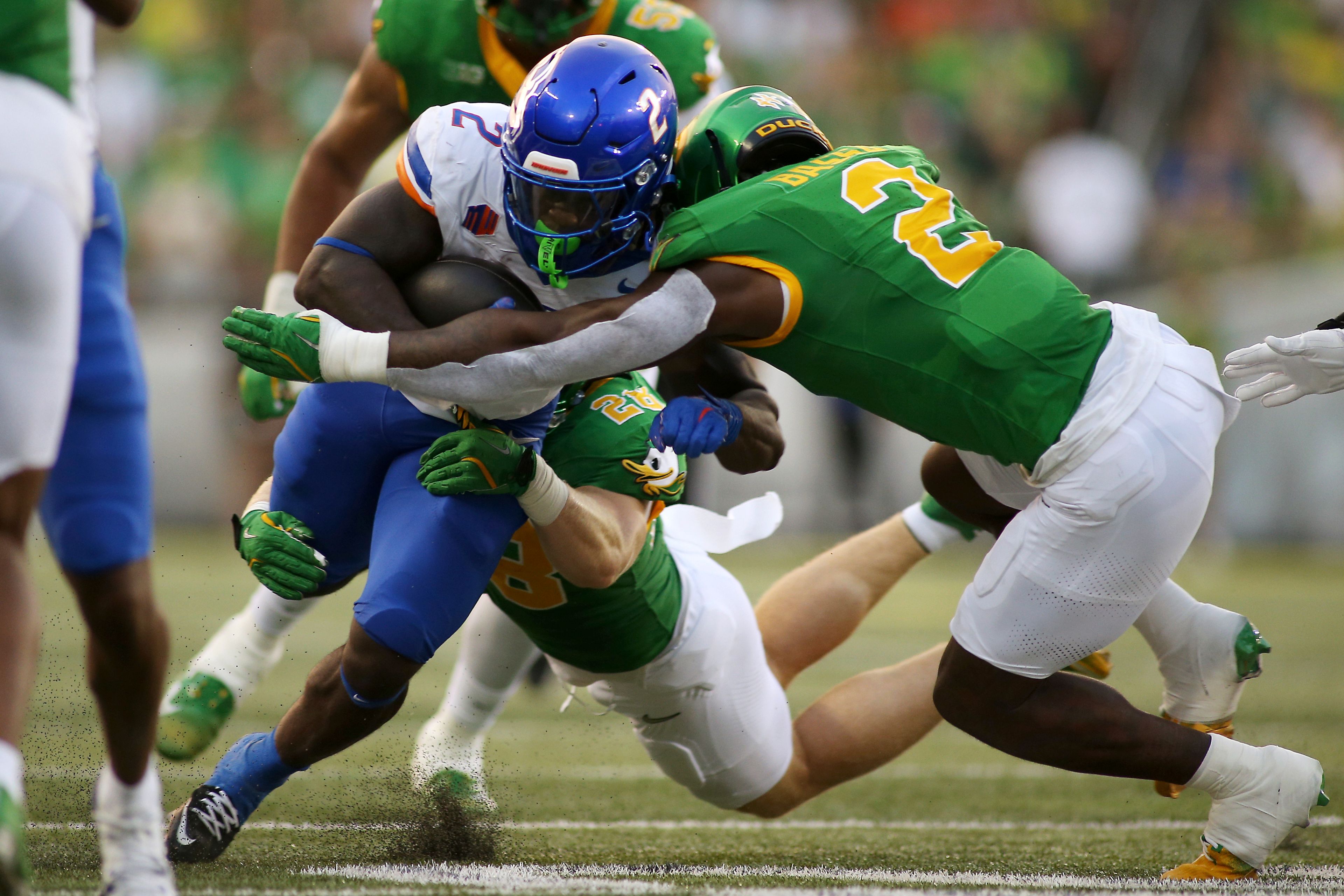 Boise State running back Ashton Jeanty (2) takes a hit from Oregon linebacker Jeffrey Bassa (2) during the first half of an NCAA college football game, Saturday, Sept. 7, 2024, at Autzen Stadium in Eugene, Ore. (AP Photo/Lydia Ely)