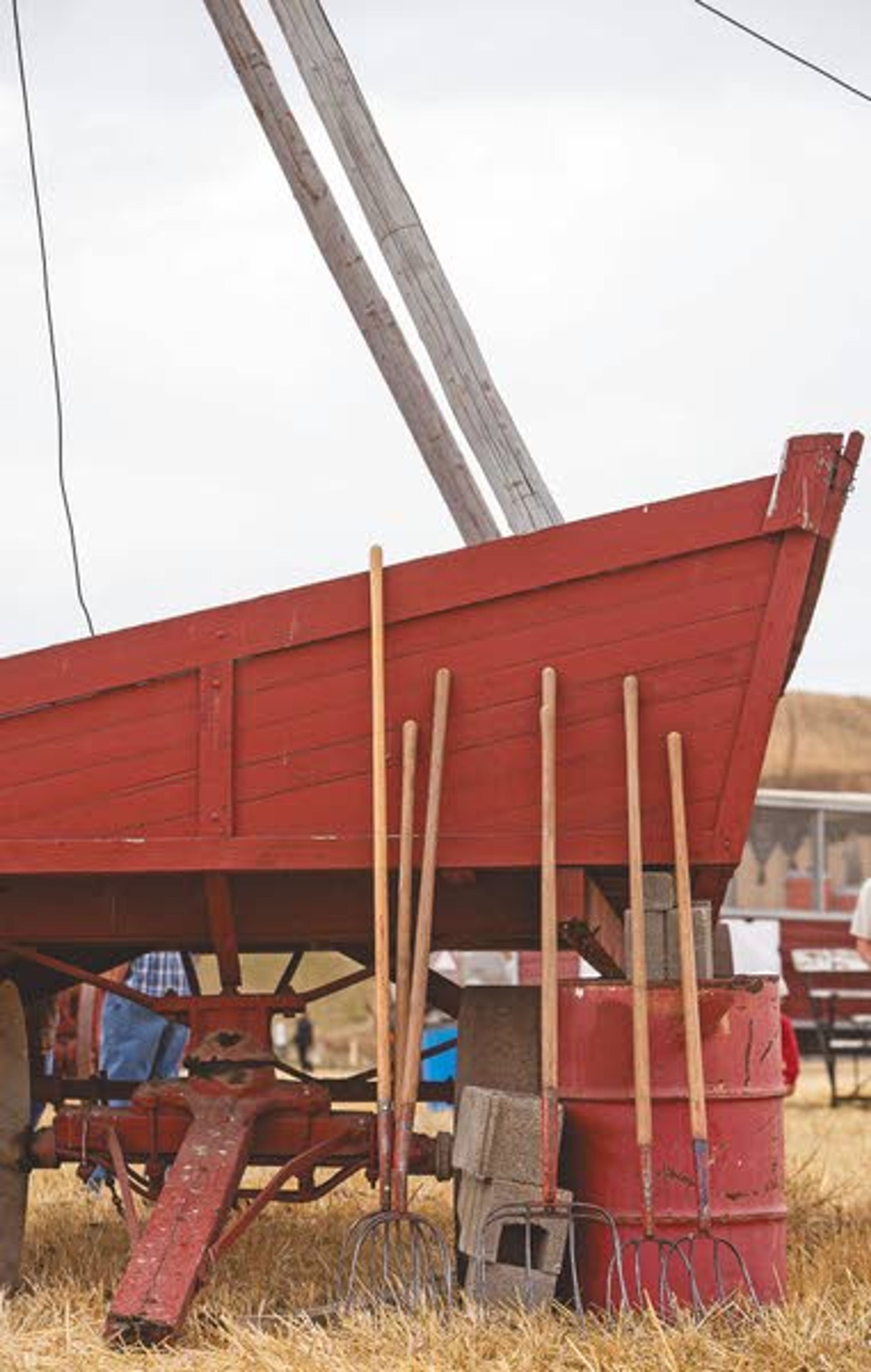 Unused pitchforks rest against a trailer during the rained-out annual Palouse Empire Threshing Bee on Monday, Sept. 2, 2013, outside the Palouse Empire Fairgrounds in Colfax.