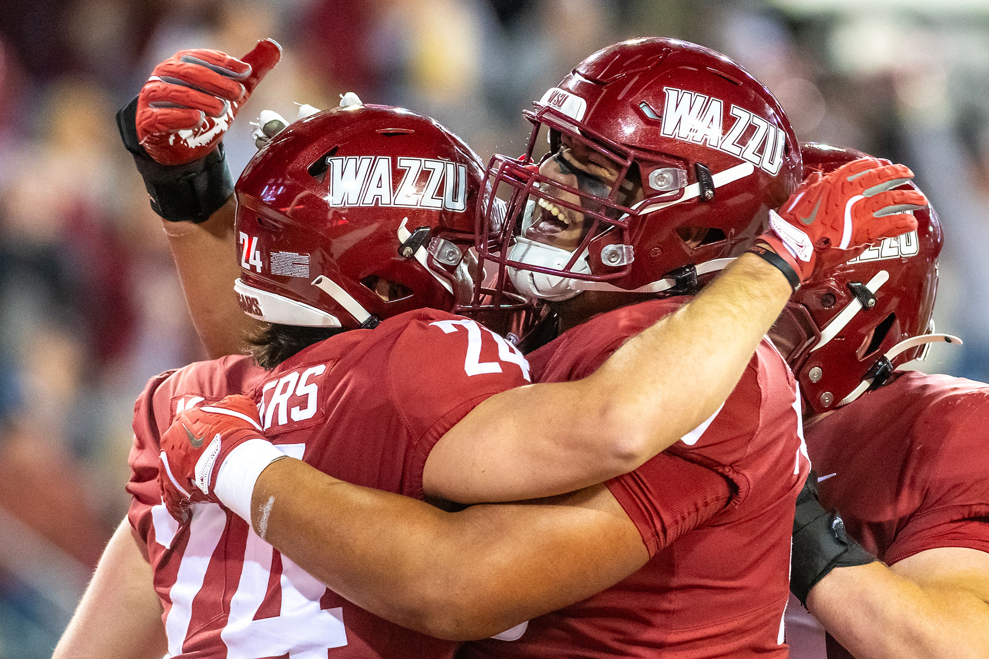 Washington State tight end Cooper Mathers celebrates a touchdown with Washington State Fa�alili Fa�amoe during a quarter of a game Friday at Gesa Field in Pullman.,