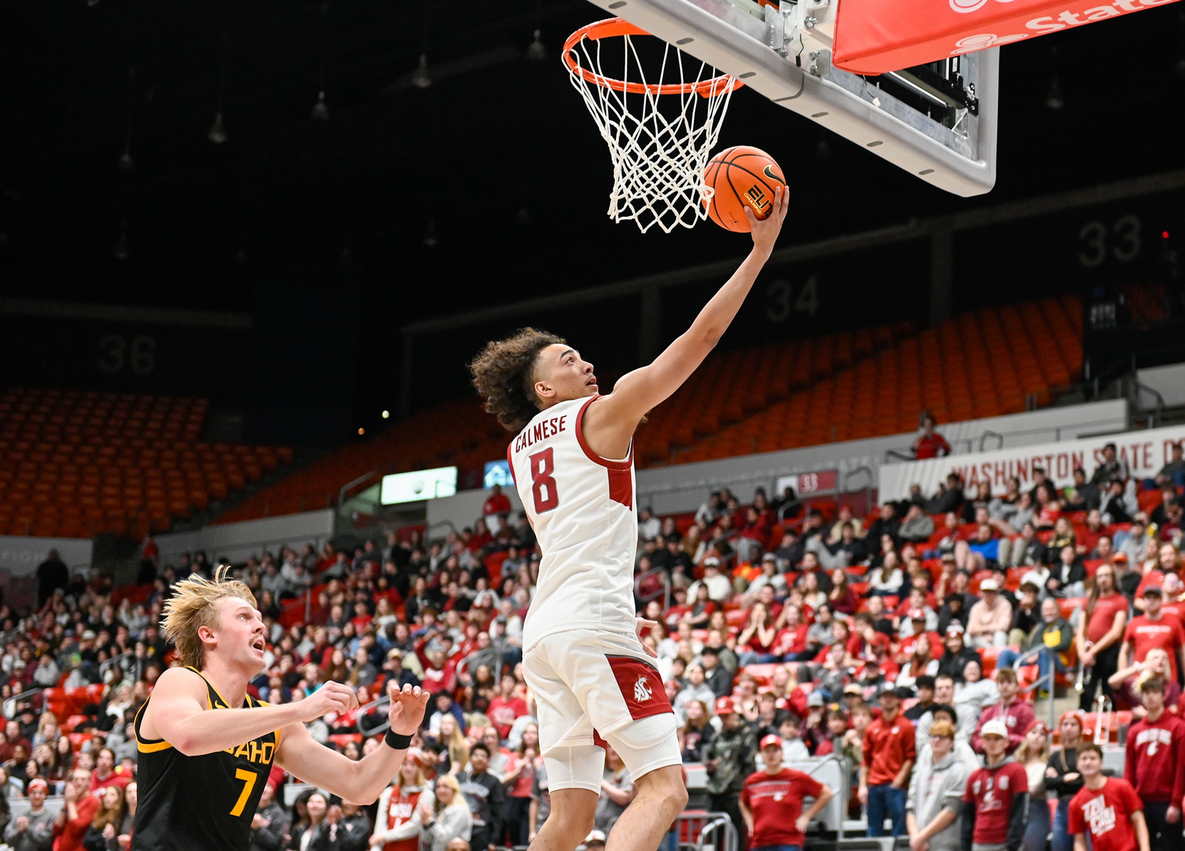 Washington State guard Nate Calmese jumps for a two-point shot in a breakaway play against Idaho at the Battle of the Palouse game Monday at Beasley Coliseum in Pullman.