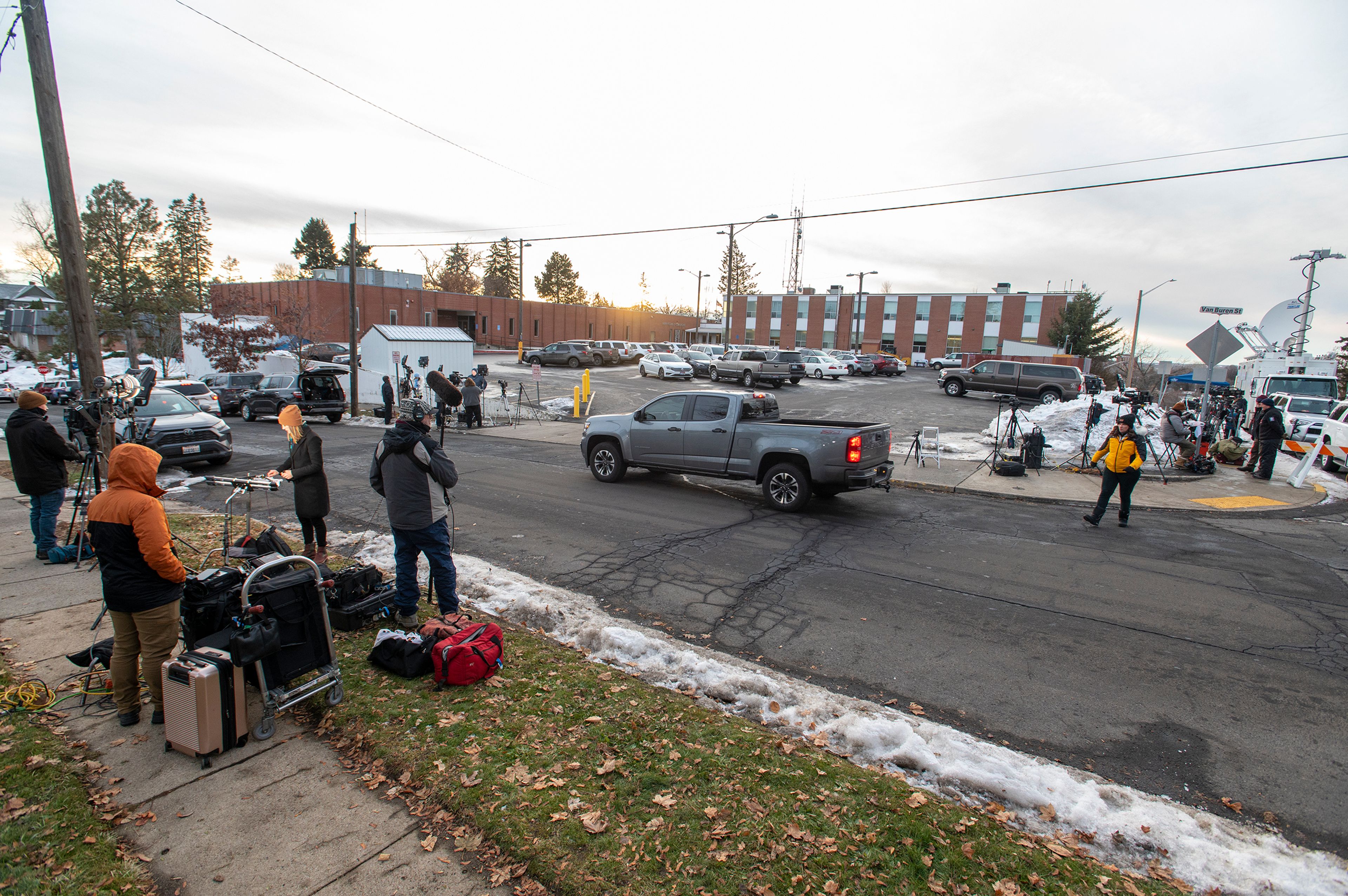 Media members setup cameras outside of the Latah County Jail as they wait for the arrival of Bryan Kohberger in Moscow on Wednesday. Kohberger is a suspect in a quadruple homicide case involving four University of Idaho students from Nov. 13.