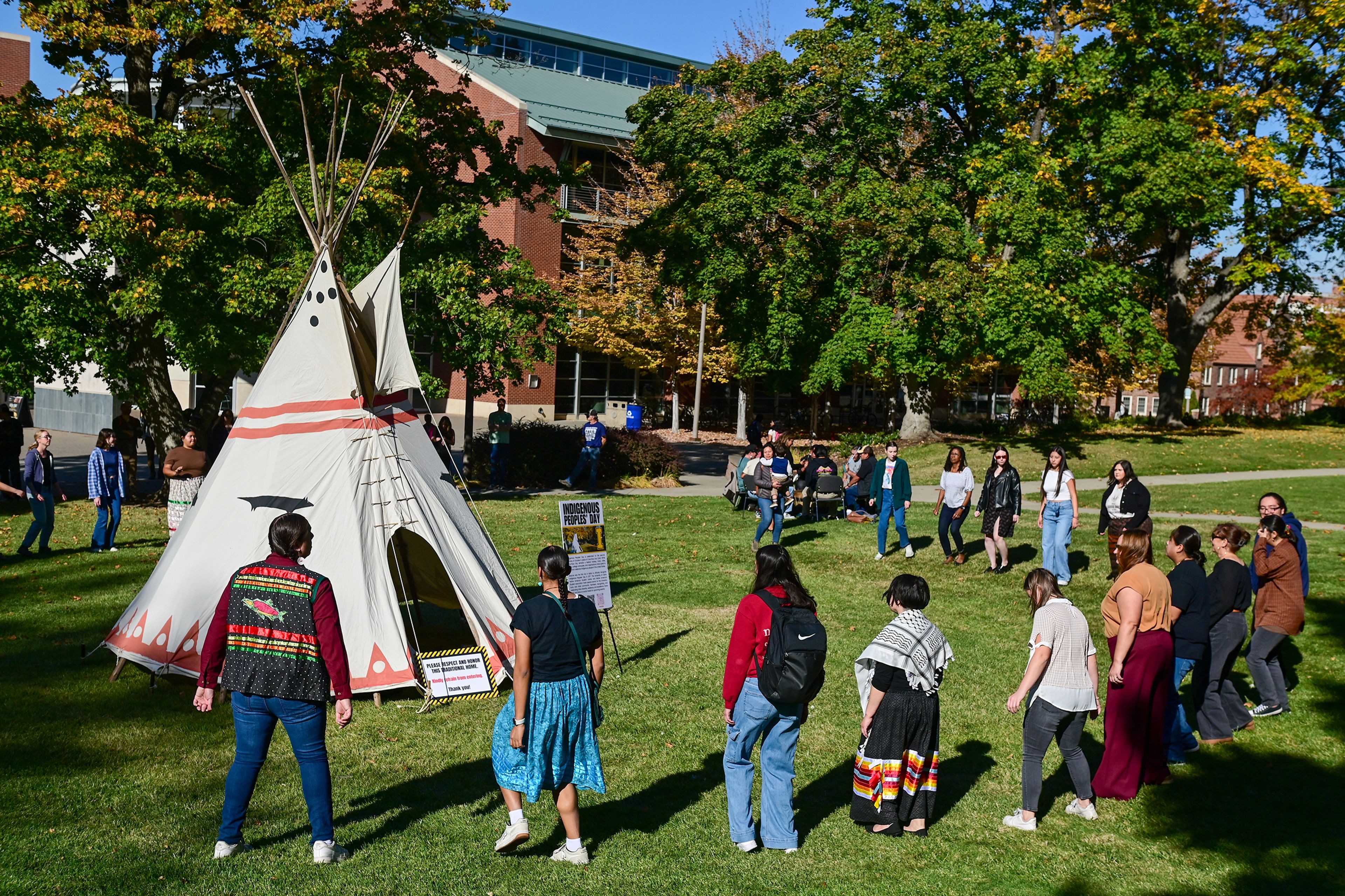 People take part in round dances Monday during the Indigenous Peoples Day event hosted by the University of Idaho Native American Student Center on campus in Moscow.