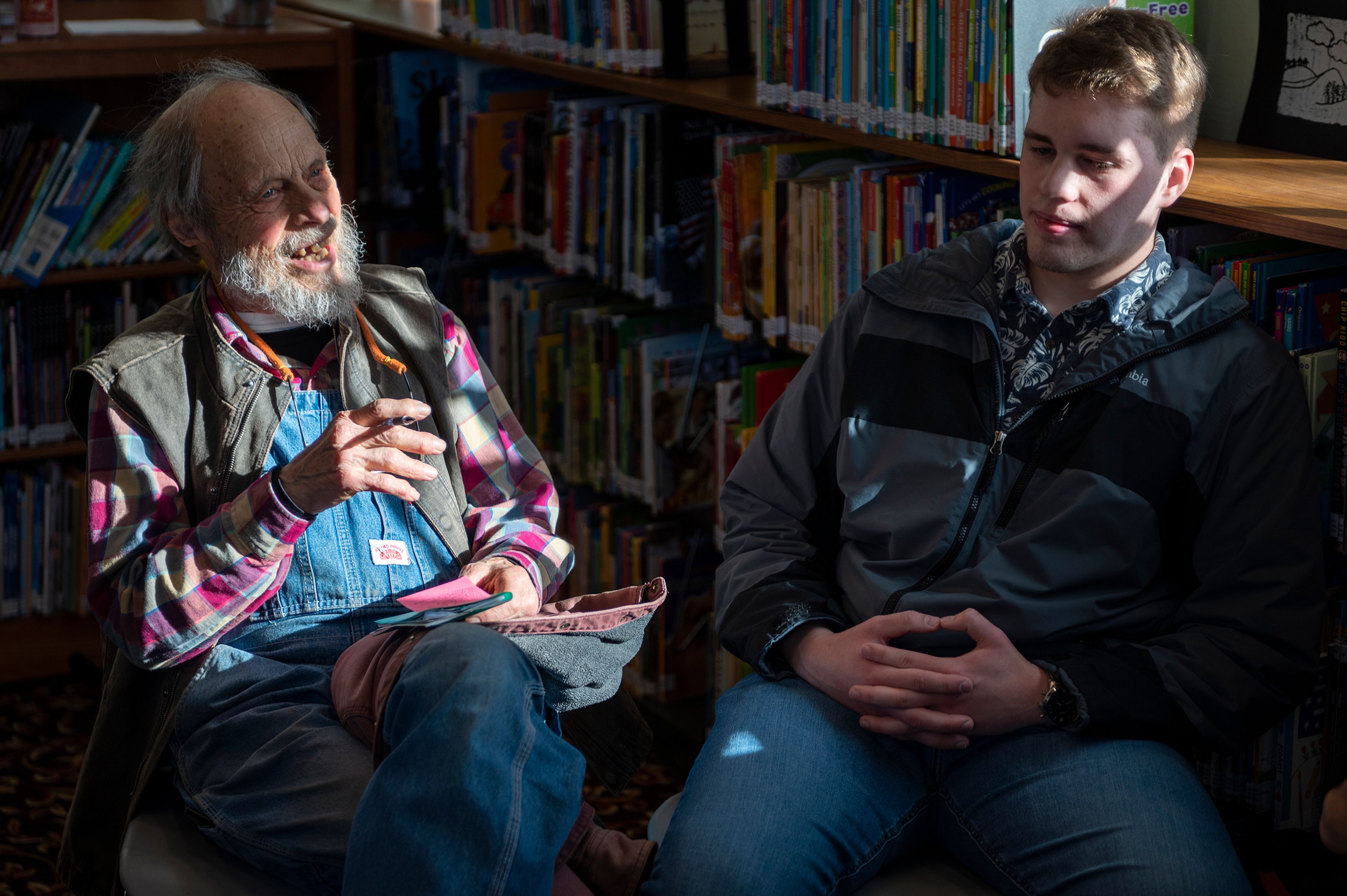 Jim Prall, left, speaks in a small group during a Death Café at the Moscow Public Library on Tuesday. “Coming away as an honorary believer of why we’re motivated to be willing to use death as the subject of what keeps us going,” Prall said.