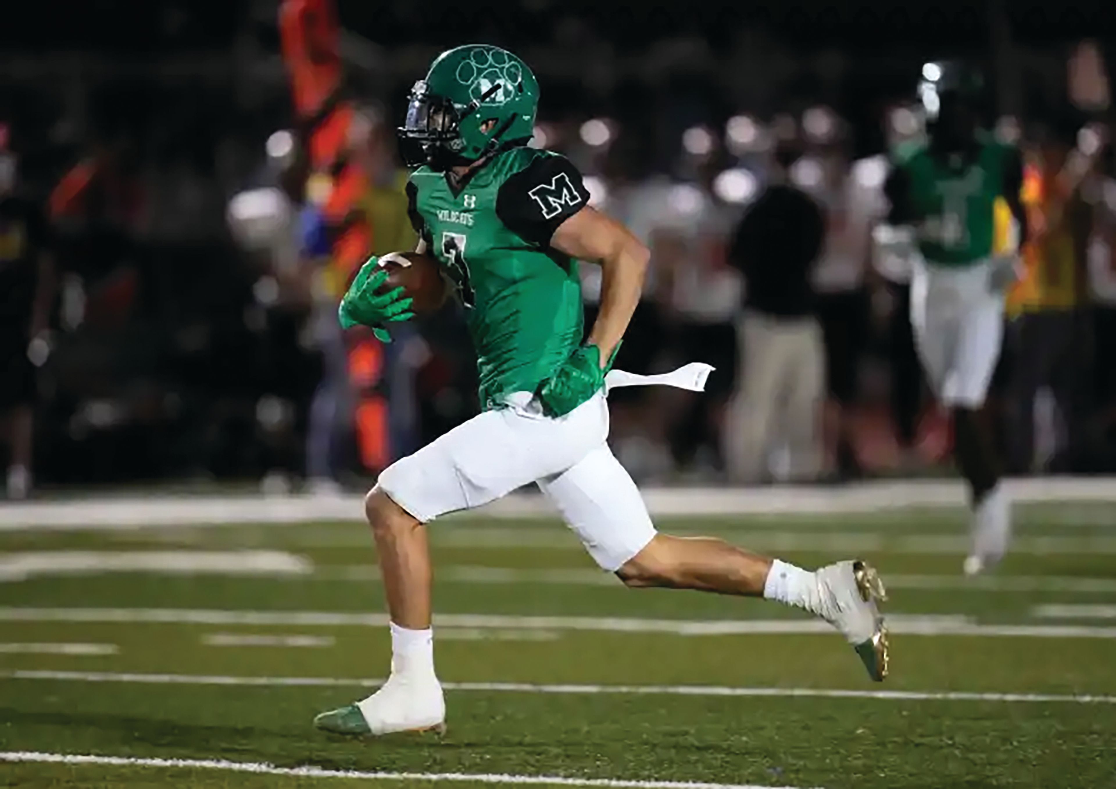 Keith Birmingham/Southern California News Group Monrovia (Calif.) High School receiver Carlos Hernandez runs for a touchdown during the first half of a 2021 game against South Pasadena. Hernandez signed a national letter of intent Wednesday with Washington State.