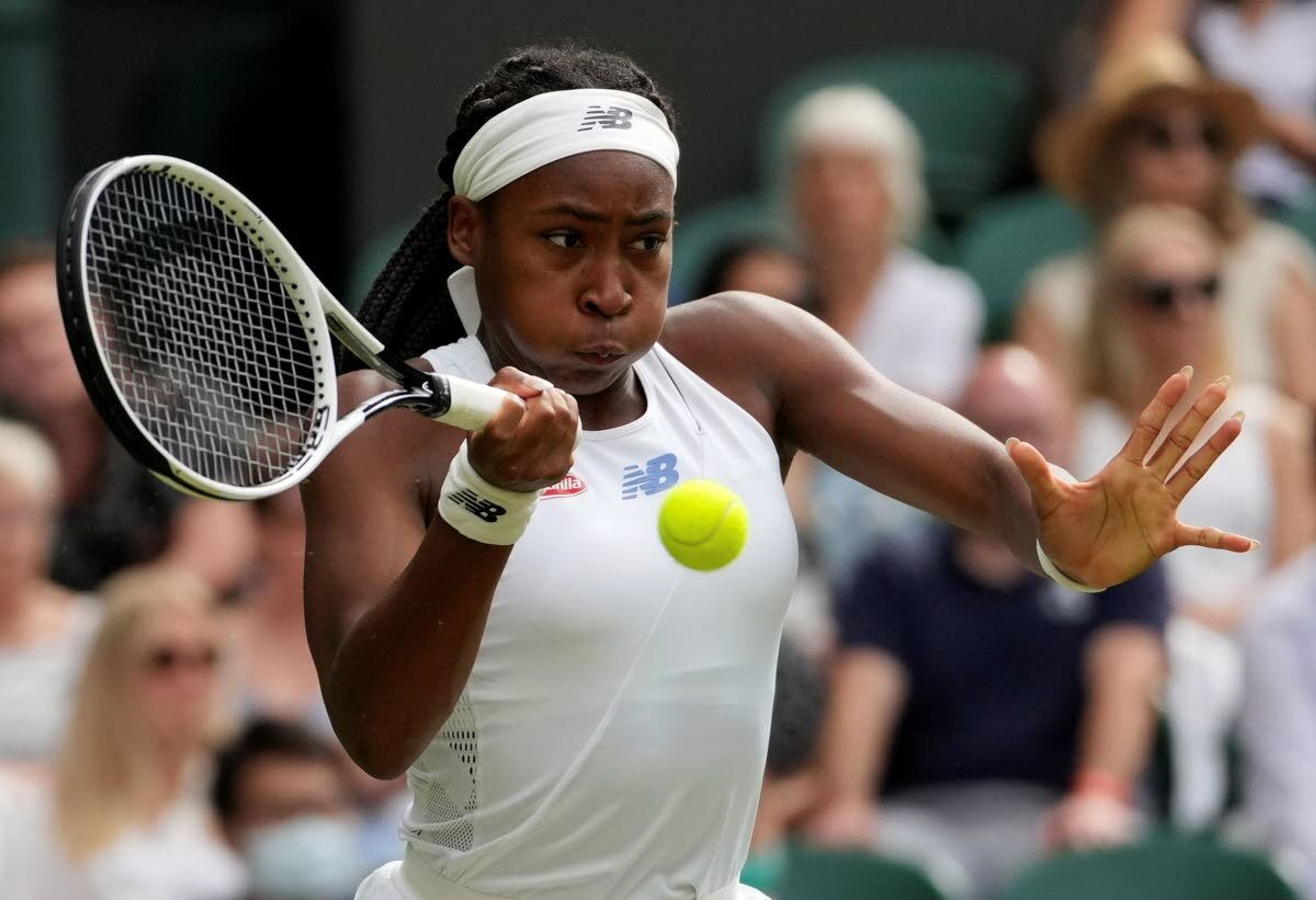 Coco Gauff of the US plays a return to Russia's Elena Vesnina during the women's singles second round match on day four of the Wimbledon Tennis Championships in London, Thursday July 1, 2021. (AP Photo/Alberto Pezzali)