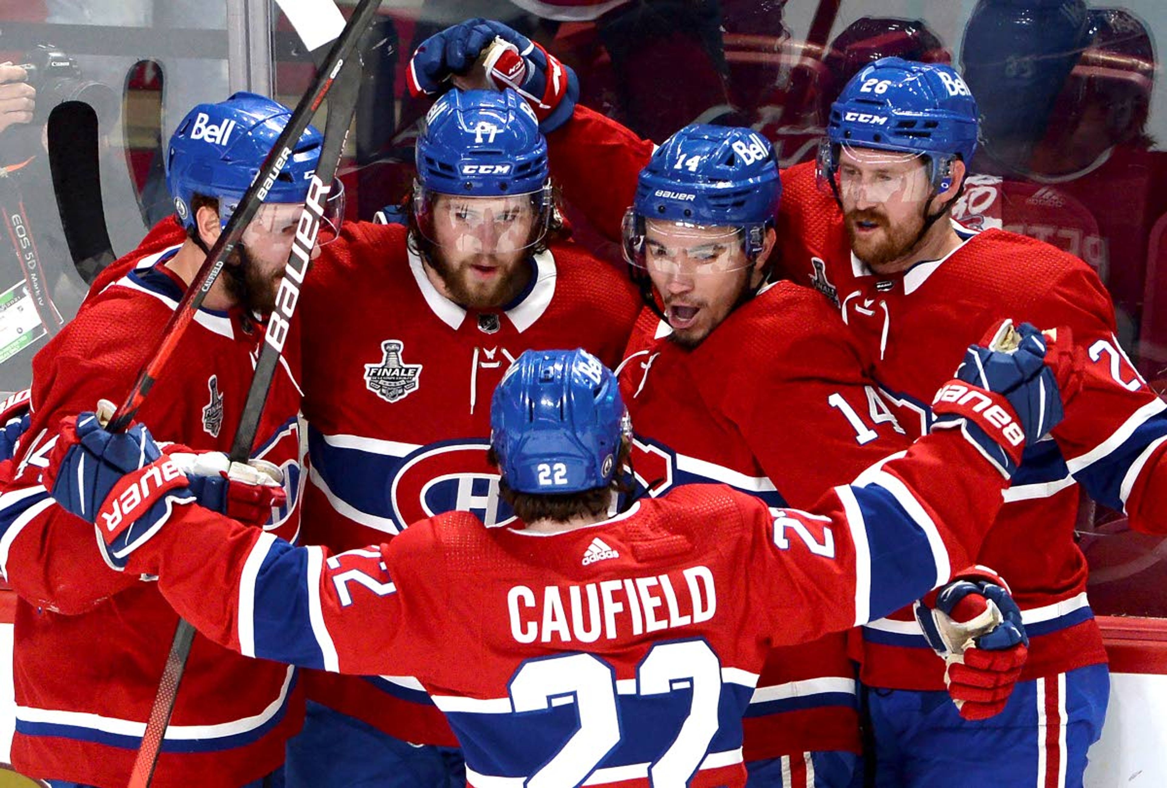 Montreal Canadiens' Josh Anderson (17) celebrates his goal against the Tampa Bay Lightning with teammates Joel Edmundson (44), Cole Caufield (22), Nick Suzuki (14) and Jeff Petry (26) during the first period of Game 4 of the NHL hockey Stanley Cup final in Montreal, Monday, July 5, 2021. (Ryan Remiorz/The Canadian Press via AP)