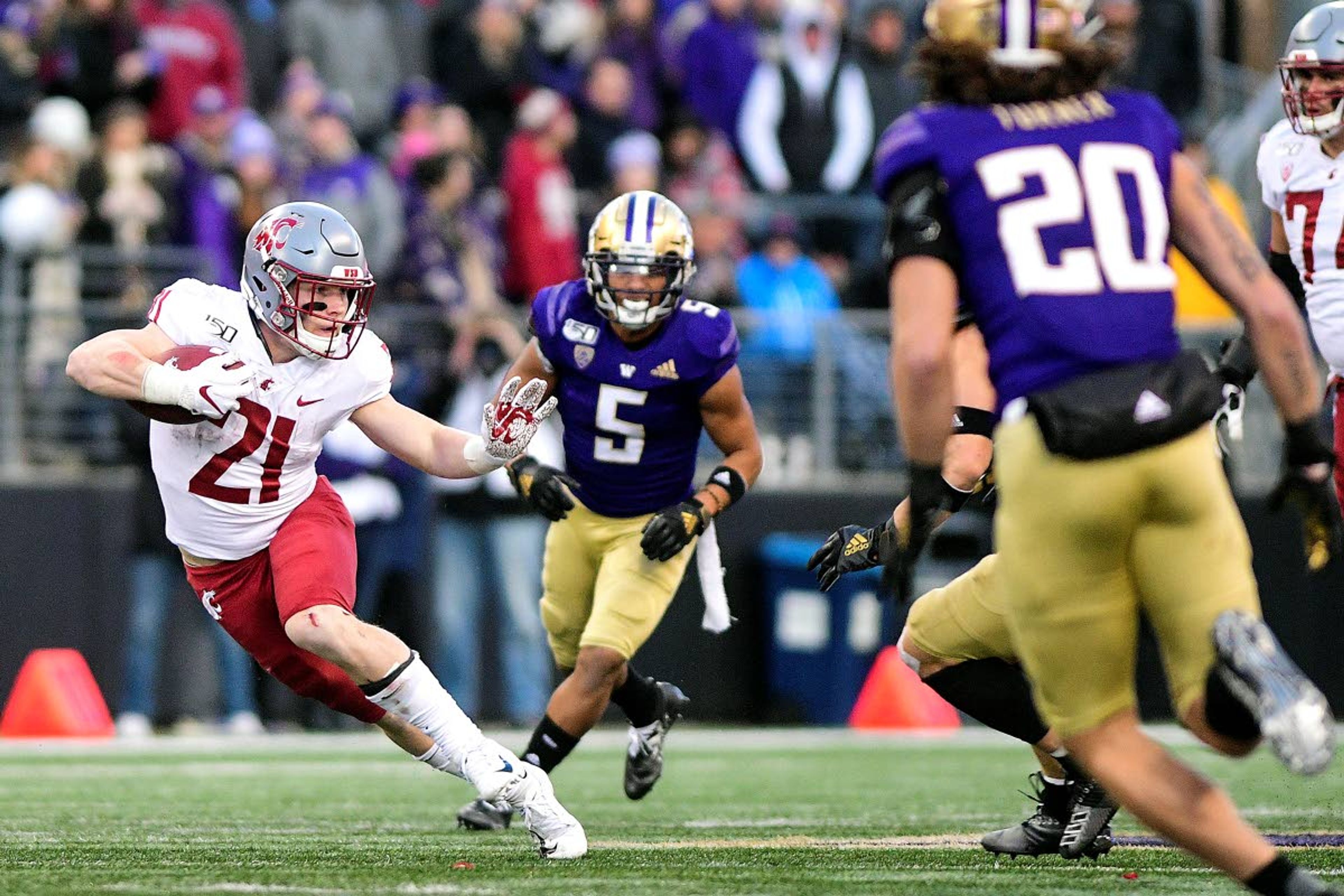 Pete Caster/Lewiston TribuneWashington State running back Max Borghi (21) finds some space in the Washington secondary during a run up the middle in the fourth quarter of a Pac-12 Conference football game Nov. 29 at Husky Stadium in Seattle. New WSU head coach Nicke Rolovich says the Cougars will run the ball more, meaning more work for Borghi next season.