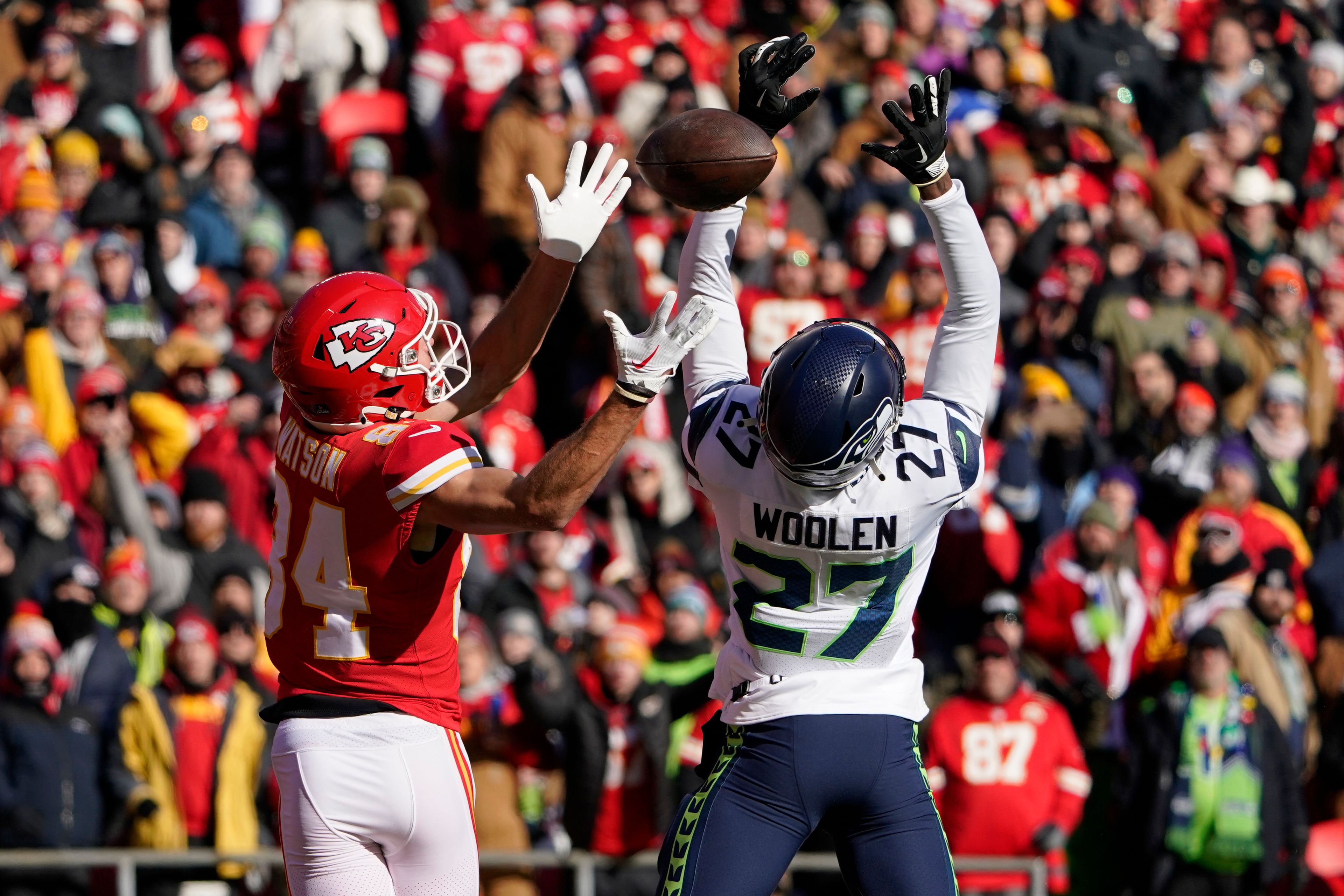 Kansas City Chiefs wide receiver Justin Watson (84) is unable to catch a pass as Seattle Seahawks cornerback Tariq Woolen (27) defends during the first half of an NFL football game Saturday, Dec. 24, 2022, in Kansas City, Mo. (AP Photo/Ed Zurga)