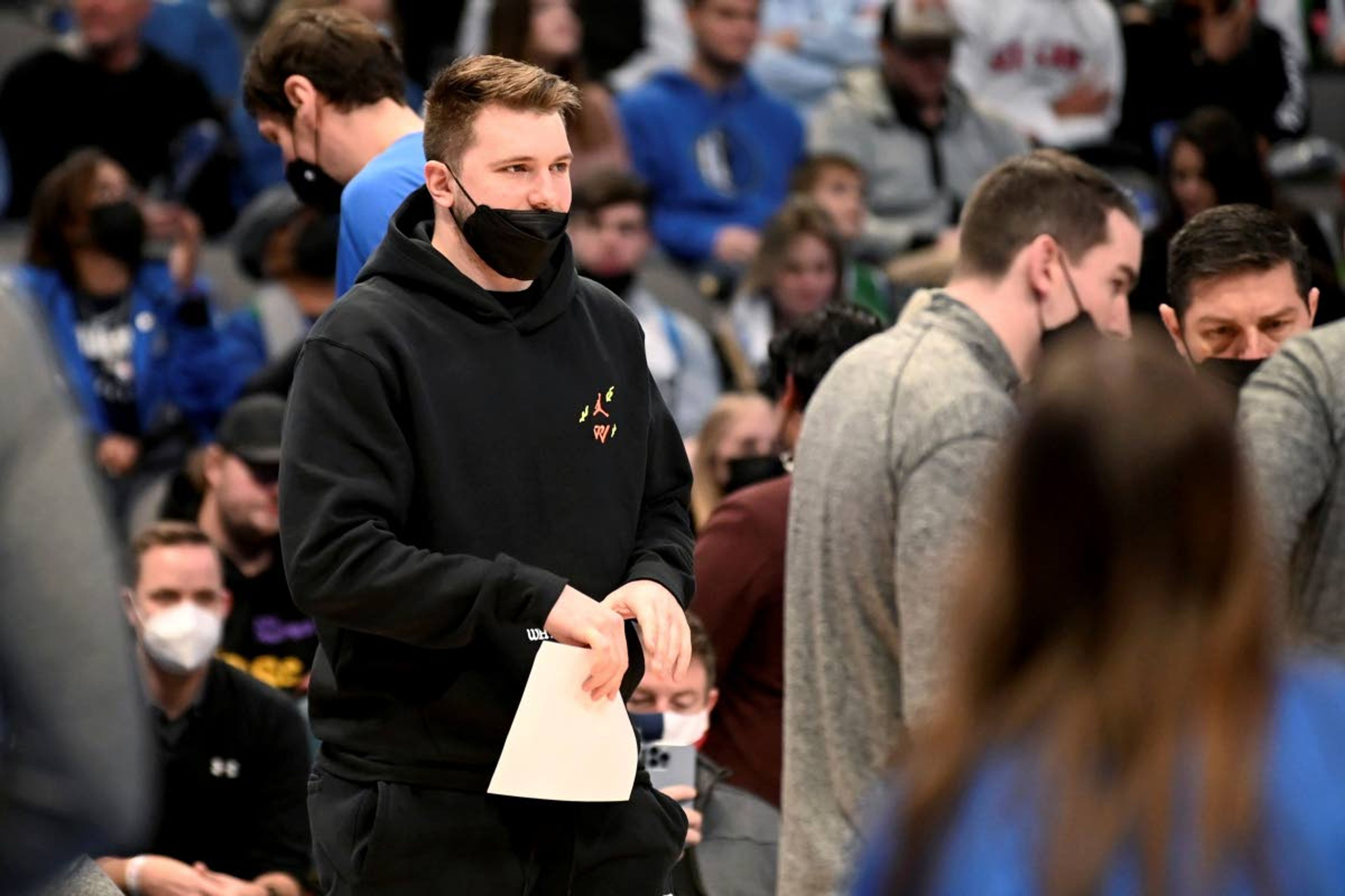 Dallas Mavericks guard Luka Doncic watches play in the first half of an NBA basketball game agents the Minnesota Timberwolves in Dallas, Tuesday, Dec. 21, 2021. (AP Photo/Matt Strasen)