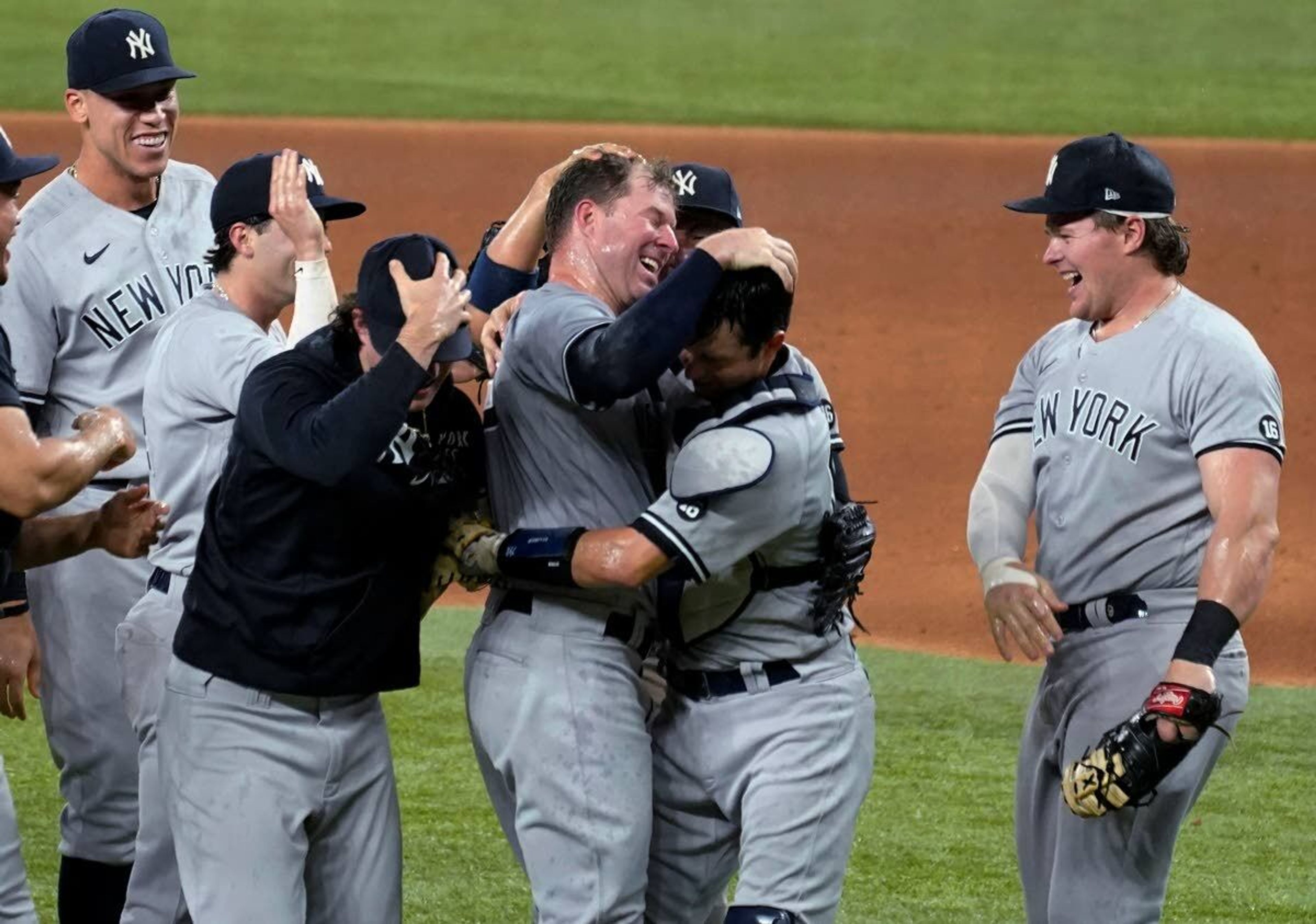 Associated PressNew York Yankees starting pitcher Corey Kluber, third from right, celebrates with teammates after throwing a no-hitter Wednesday against Texas.