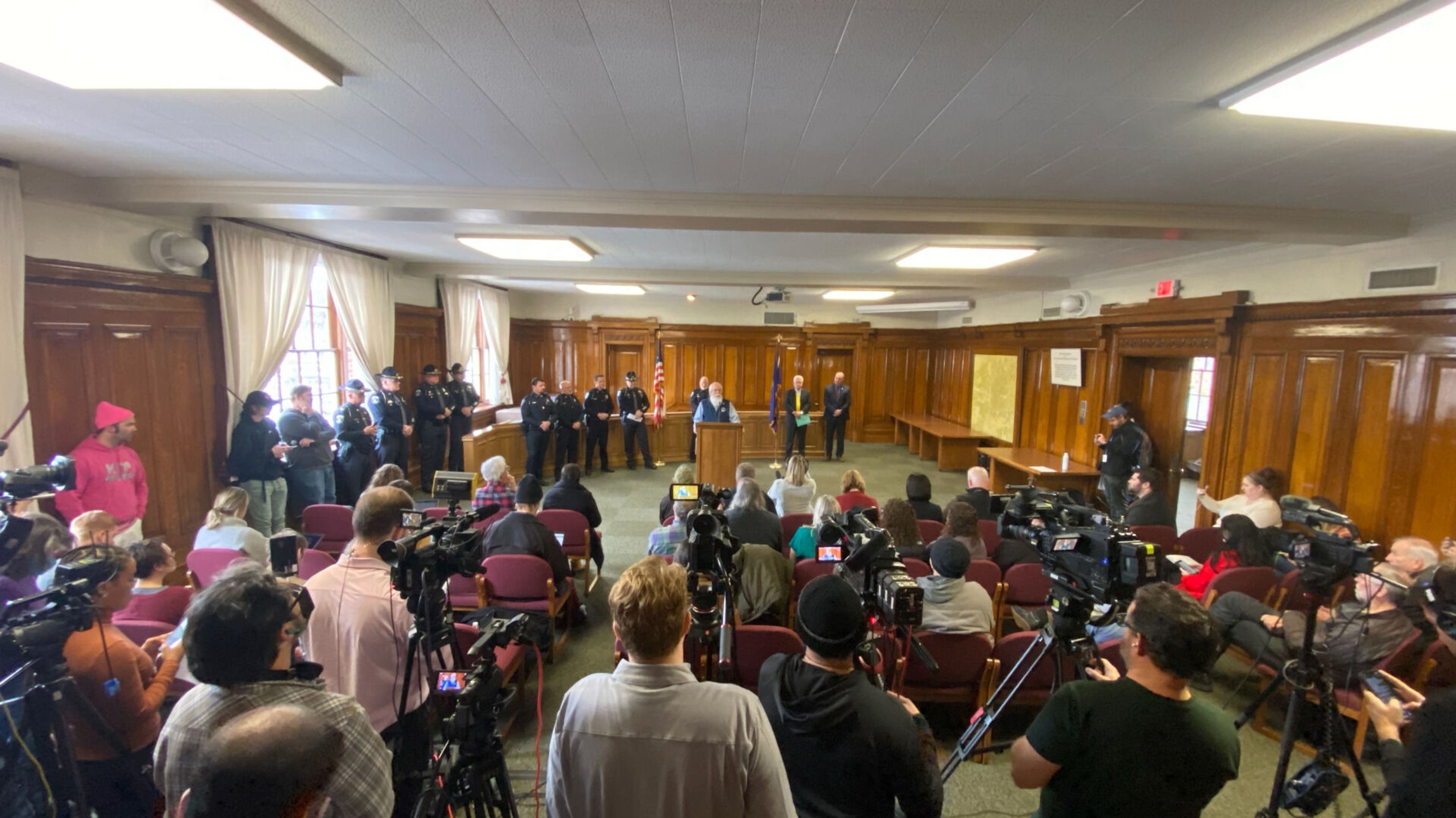 The media listens to Latah County Prosecutor Bill Thompson on Friday afternoon talk about the arrest of a suspect in the murders of four University of Idaho students Nov. 13.