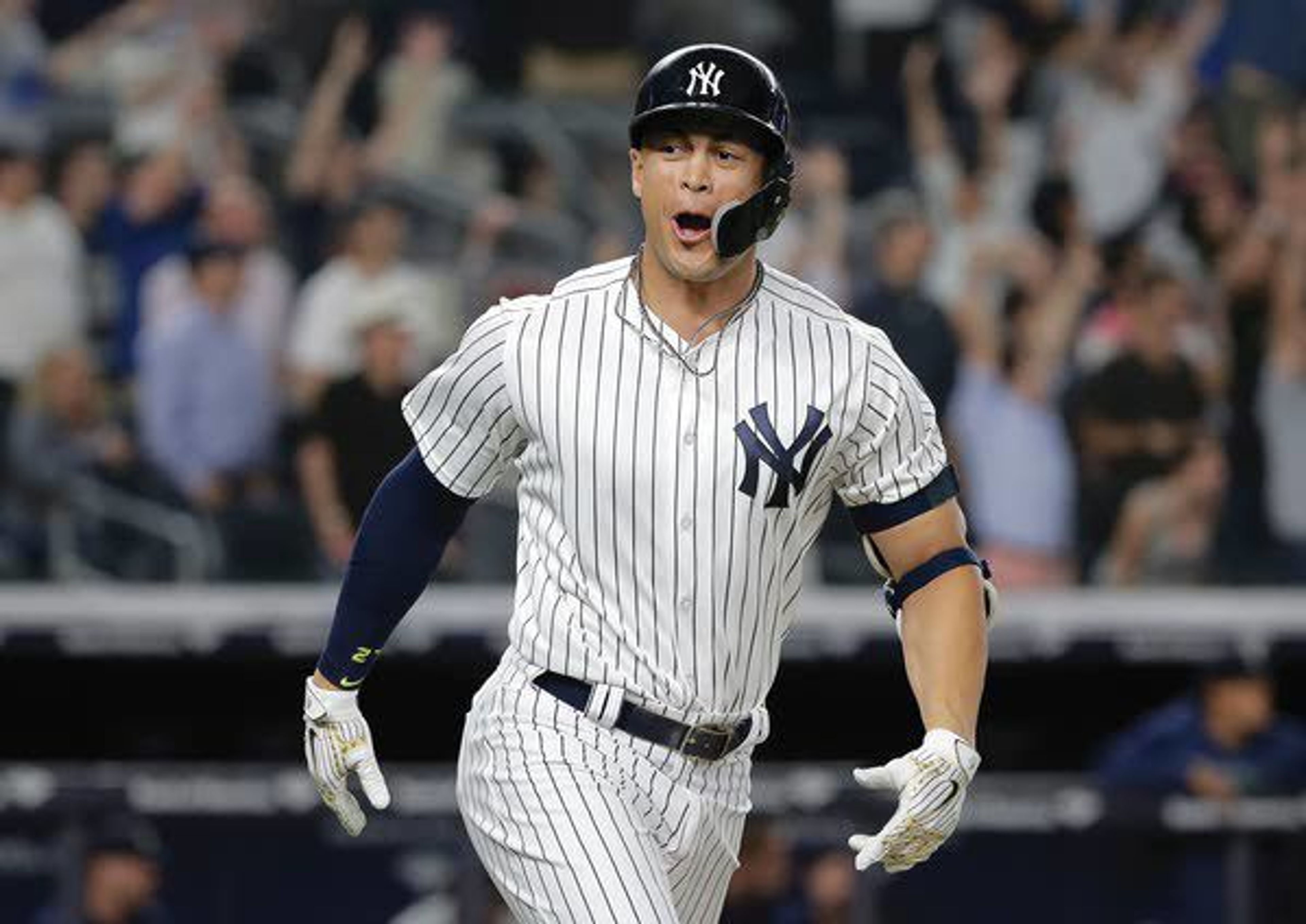 Yankees’ Giancarlo Stanton reacts after hitting a walk-off two-run home run during the ninth inning Wednesday against the Mariners at Yankee Stadium.