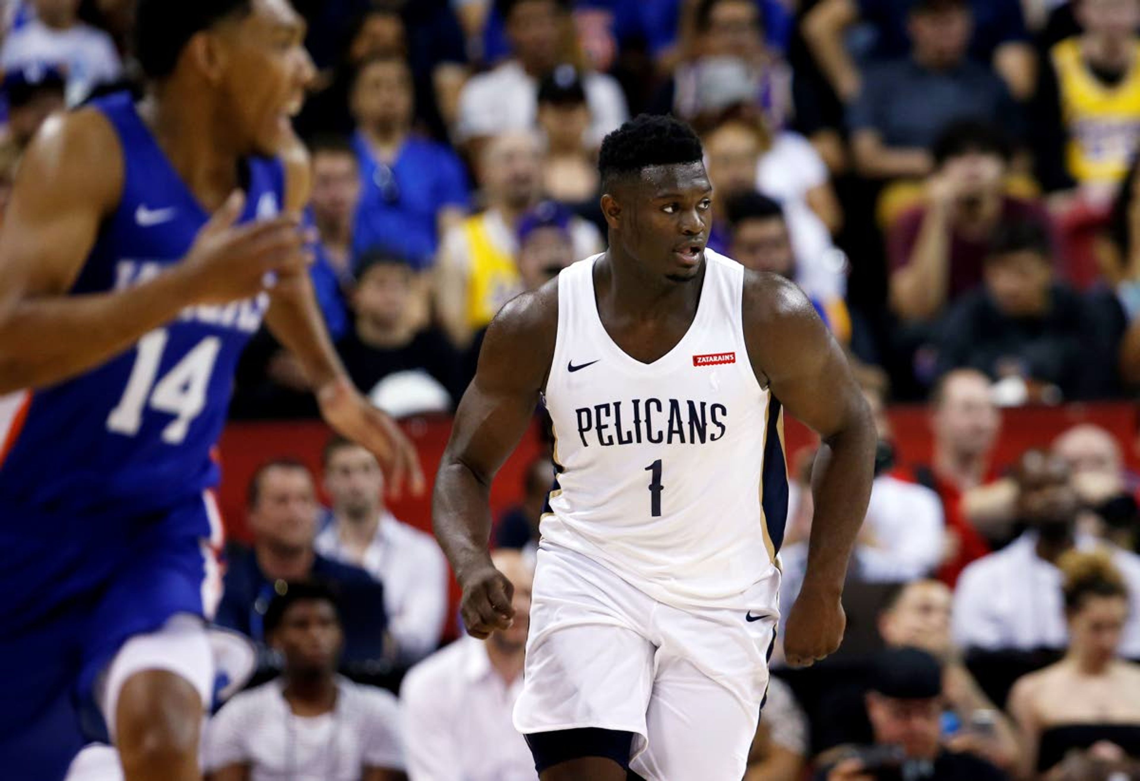 AP Photo/Steve MarcusThe Pelicans’ Zion Williamson (1) runs upcourt during the team’s NBA summer league basketball game against the Knicks on Friday in Las Vegas. The Knicks’ Allonzo Trier is at left.