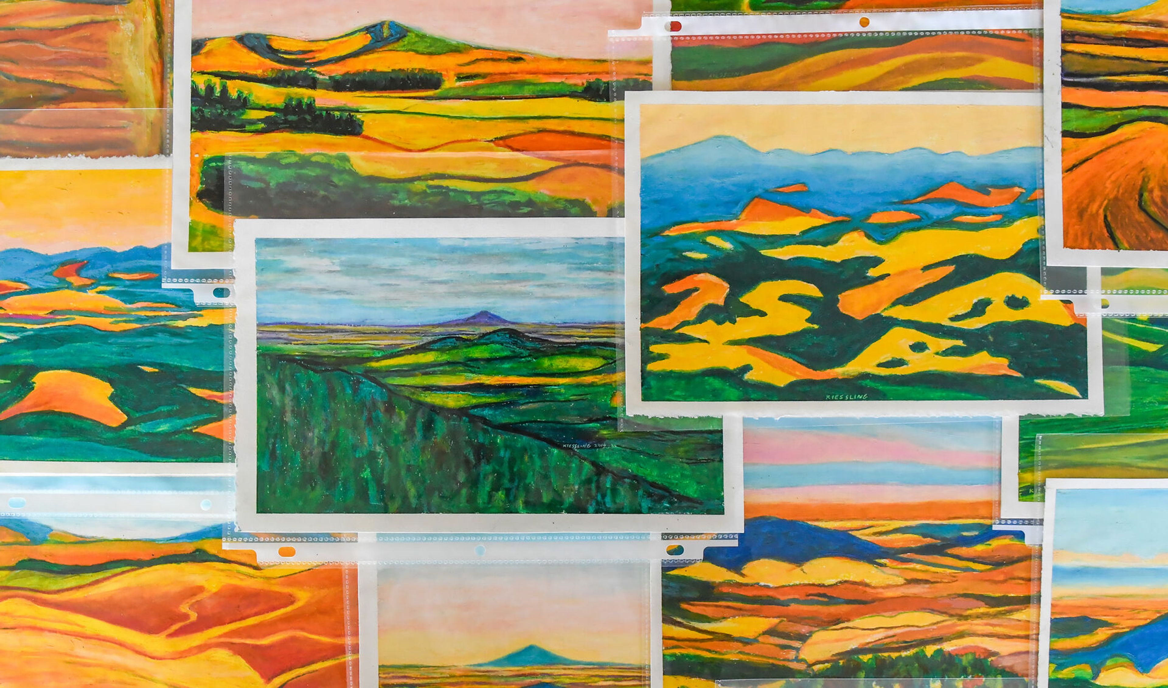 A collection of Dan Kiessling’s Palouse County pastels are laid out in his parent’s home in Pullman on Tuesday. Similar pieces will be shown at a celebration of life art show in his honor on June 22 at the Bank Left Art Gallery in Palouse.