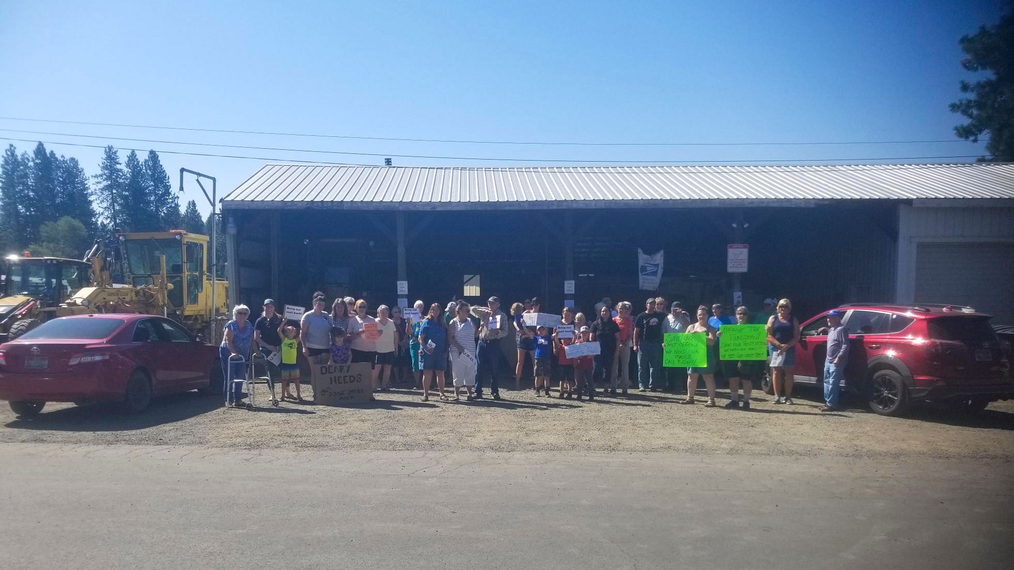 Deary residents gather Wednesday to protest the temporary removal of the city’s Post Office services.