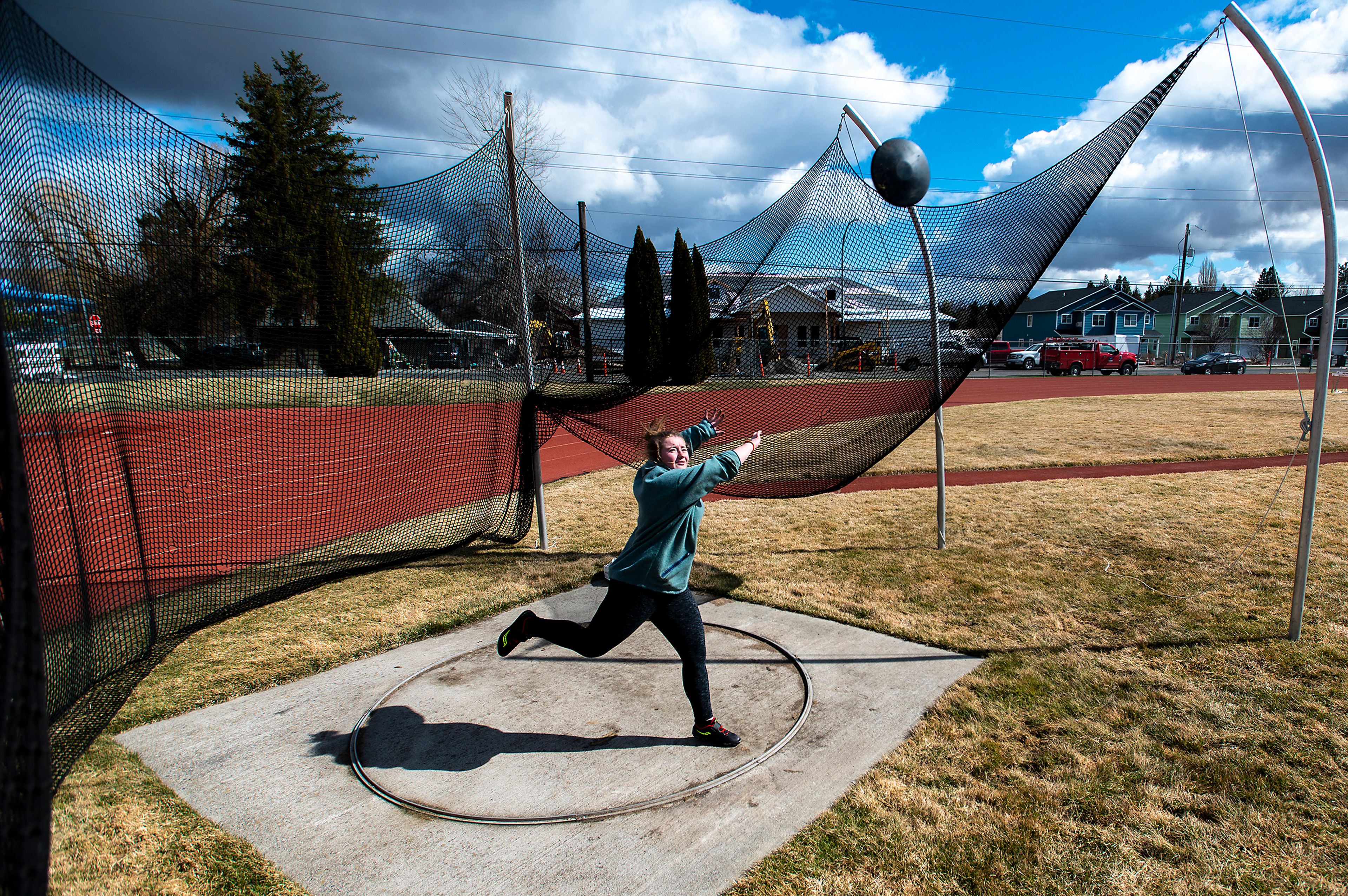 Ellen Heyns, a senior at Moscow High School, practices her technique for discus Wednesday afternoon at Moscow Middle School. Heyns, a first-year track and field member, said she transitioned from tennis to track and field to try something new. “It’s different just because tennis relies more on hand-eye coordination while throwing involves full-body coordination matched with strength,” Heyns said.