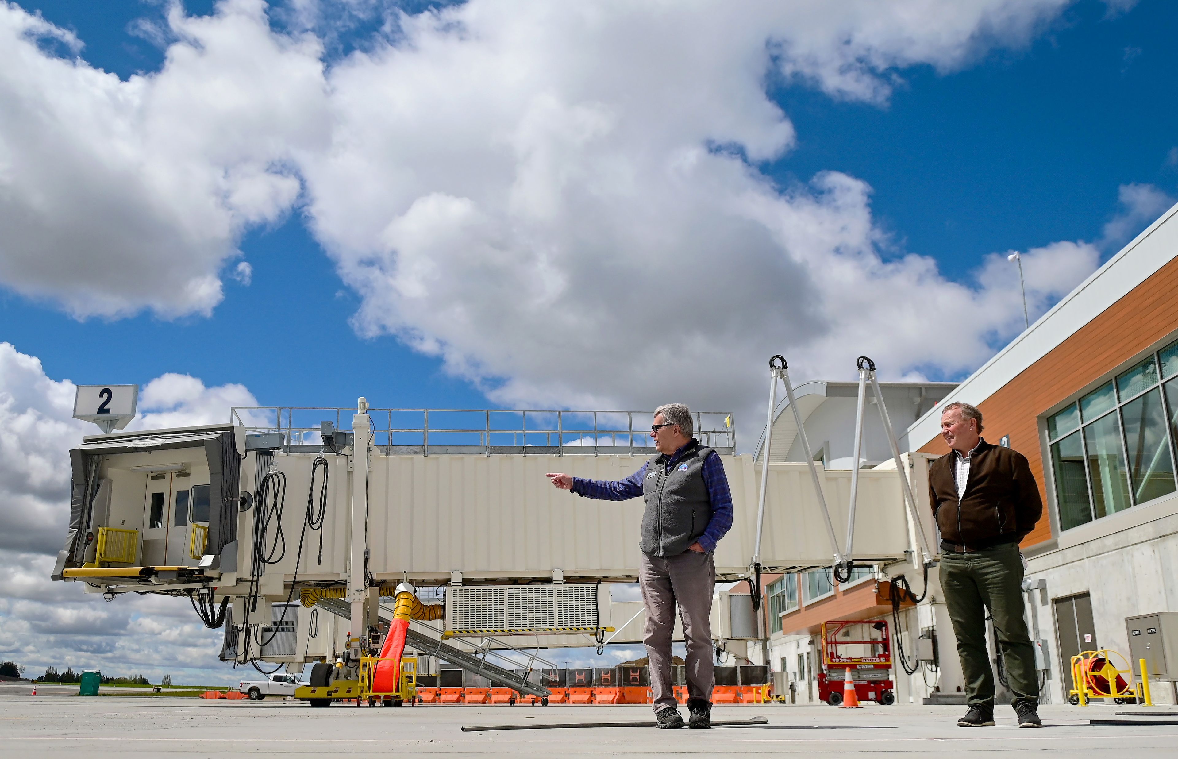 Moscow mayor Art Bettge, left, and Pullman mayor Francis Benjamin stand on the tarmac of the new terminal for the Pullman-Moscow Regional Airport at Schweitzer Field in Pullman on Tuesday. The mayors led a media tour of the facilities, which will open for public use on May 22.