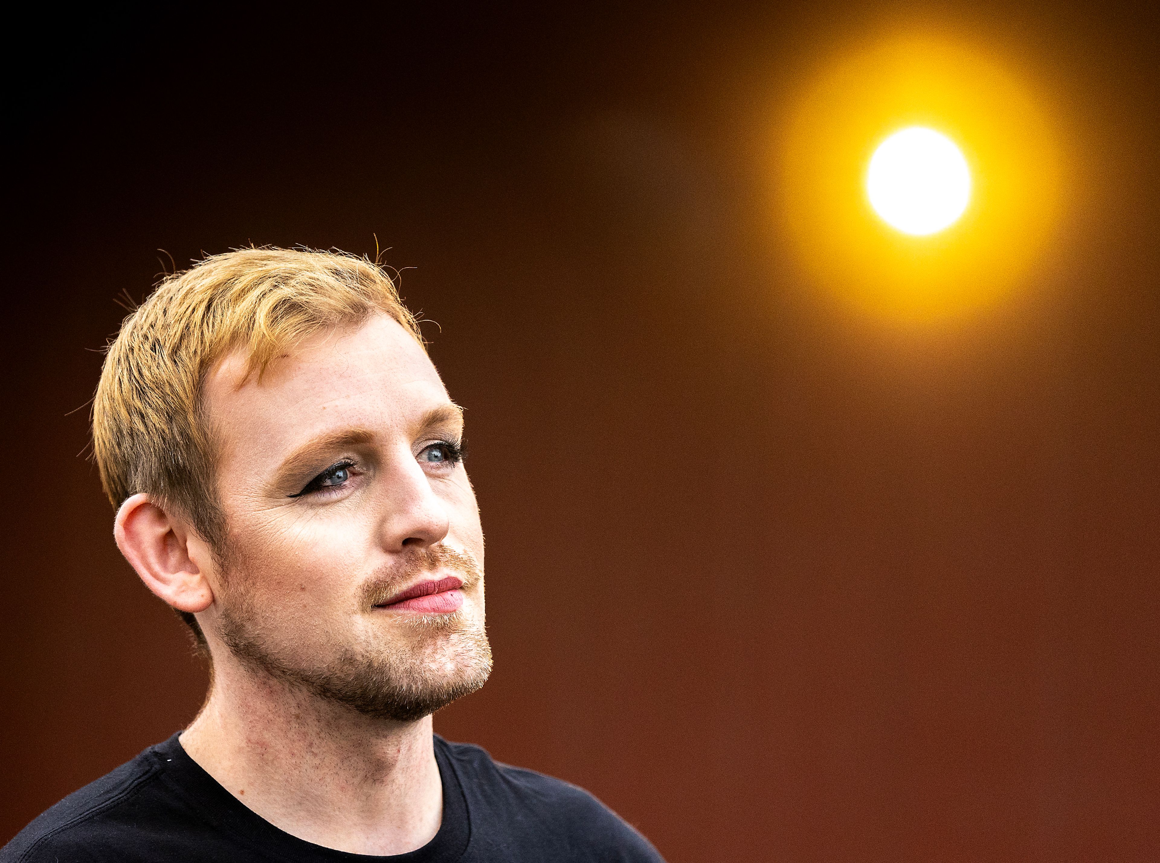 Micheal Keene poses for a photo wearing 2010s-inspired makeup applied by Jacey Johnson.