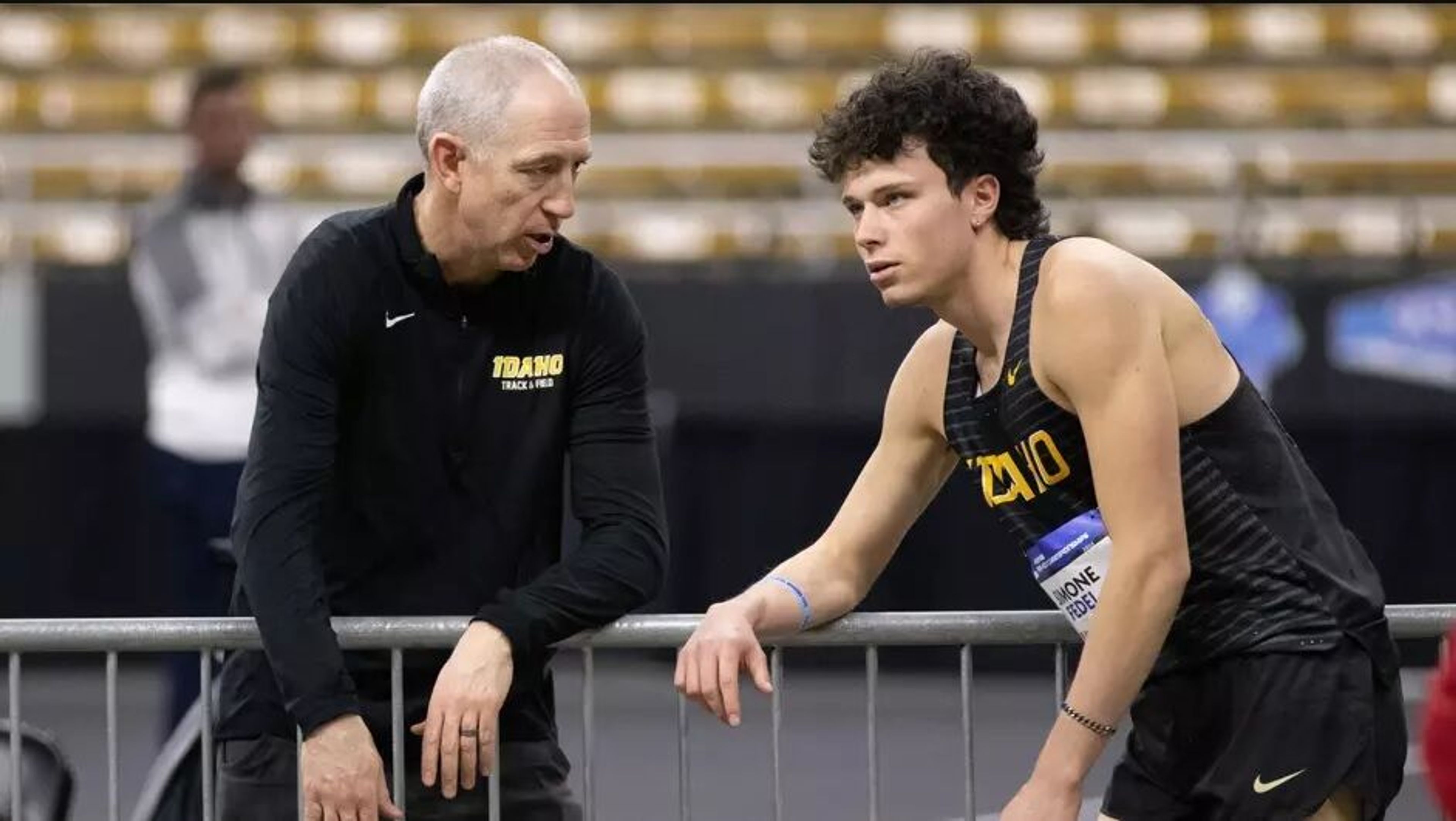 Idaho track and field and cross country coach Tim Cawley, left, speaks with a Vandal athlete in this undated photo. Cawley stepped down from his coaching position with the Vandals to pursue another NCAA Division I opportunity, it was announced Wednesday.