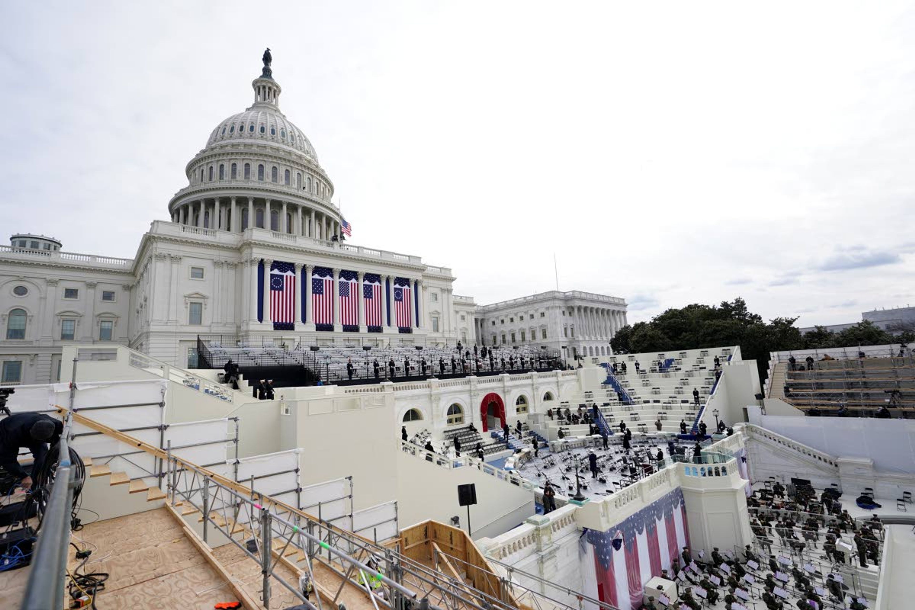 Preparations are made prior to a dress rehearsal for the 59th inaugural ceremony for President-elect Joe Biden and Vice President-elect Kamala Harris on Monday, January 18, 2021 at the U.S. Capitol in Washington. (AP Photo/Carolyn Kaster)