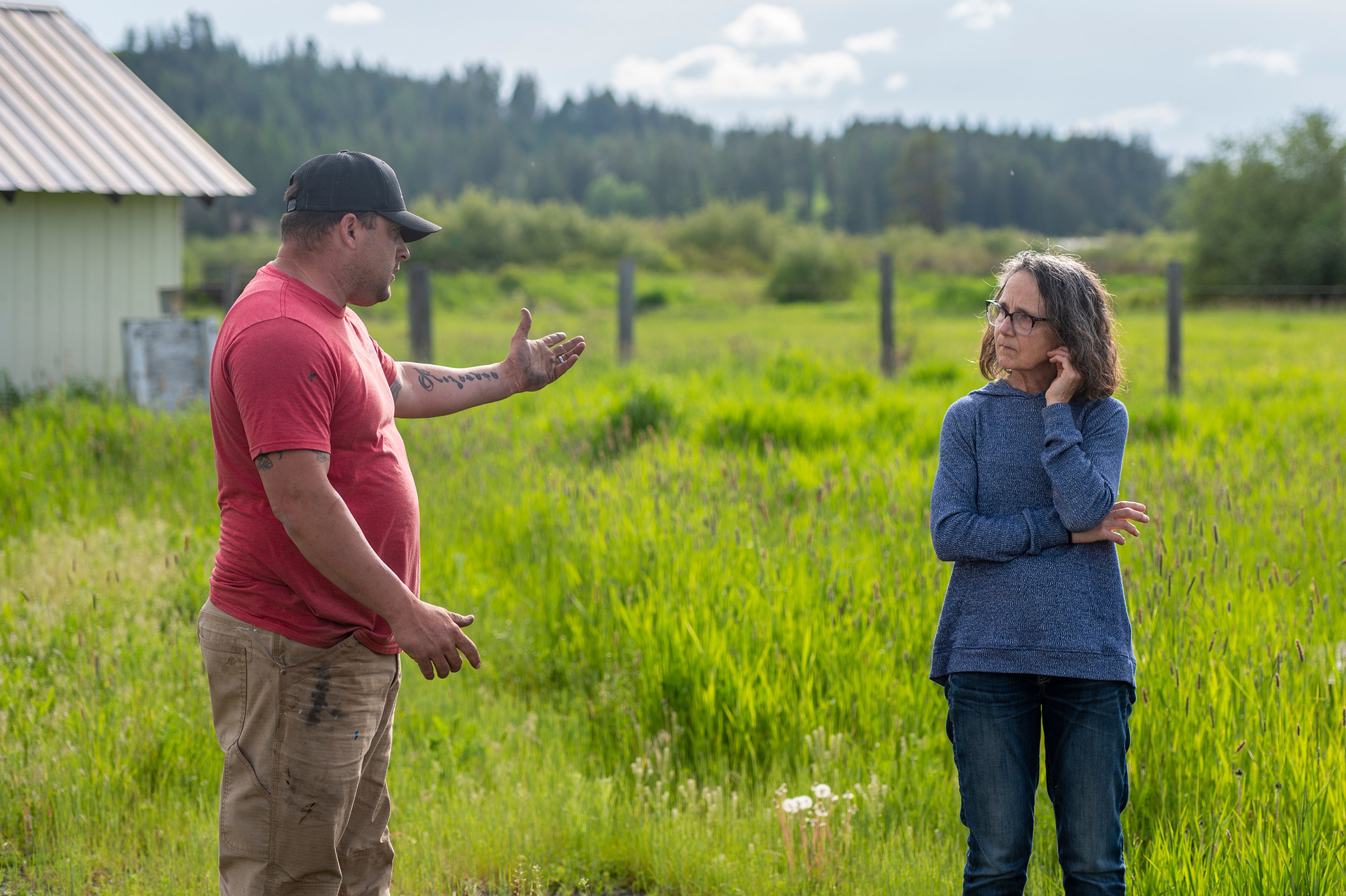 Operator Leonard Johnson and Latah County Commissioner Kathie LaFortune discuss solutions to Harvard’s failing sewage system on Wednesday.