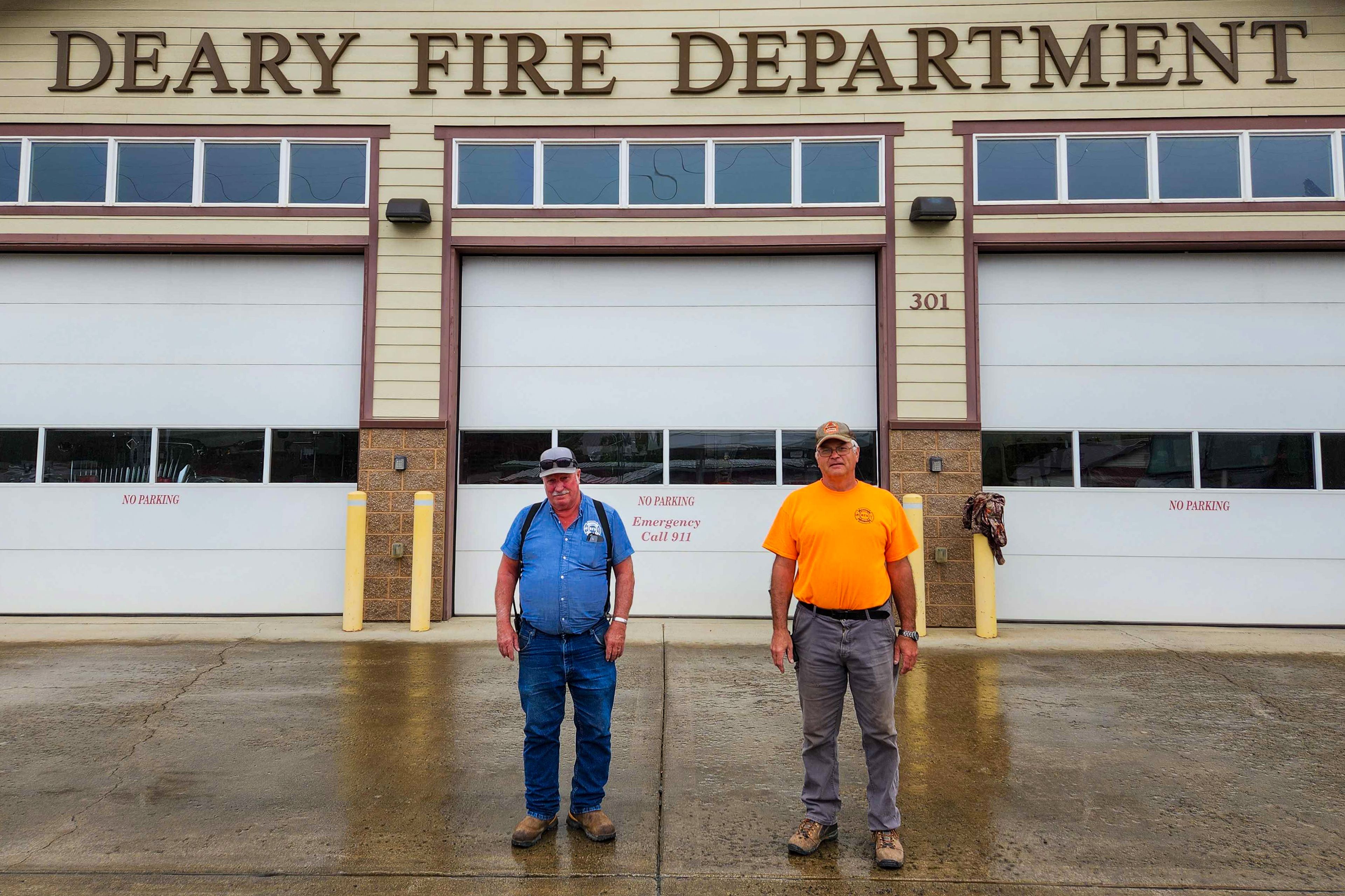 Denny Proctor, left, and Tim Jones stand in-front of the Deary Fire Department on Thursday. Jones and Proctor have volunteered at the department for 50 years.