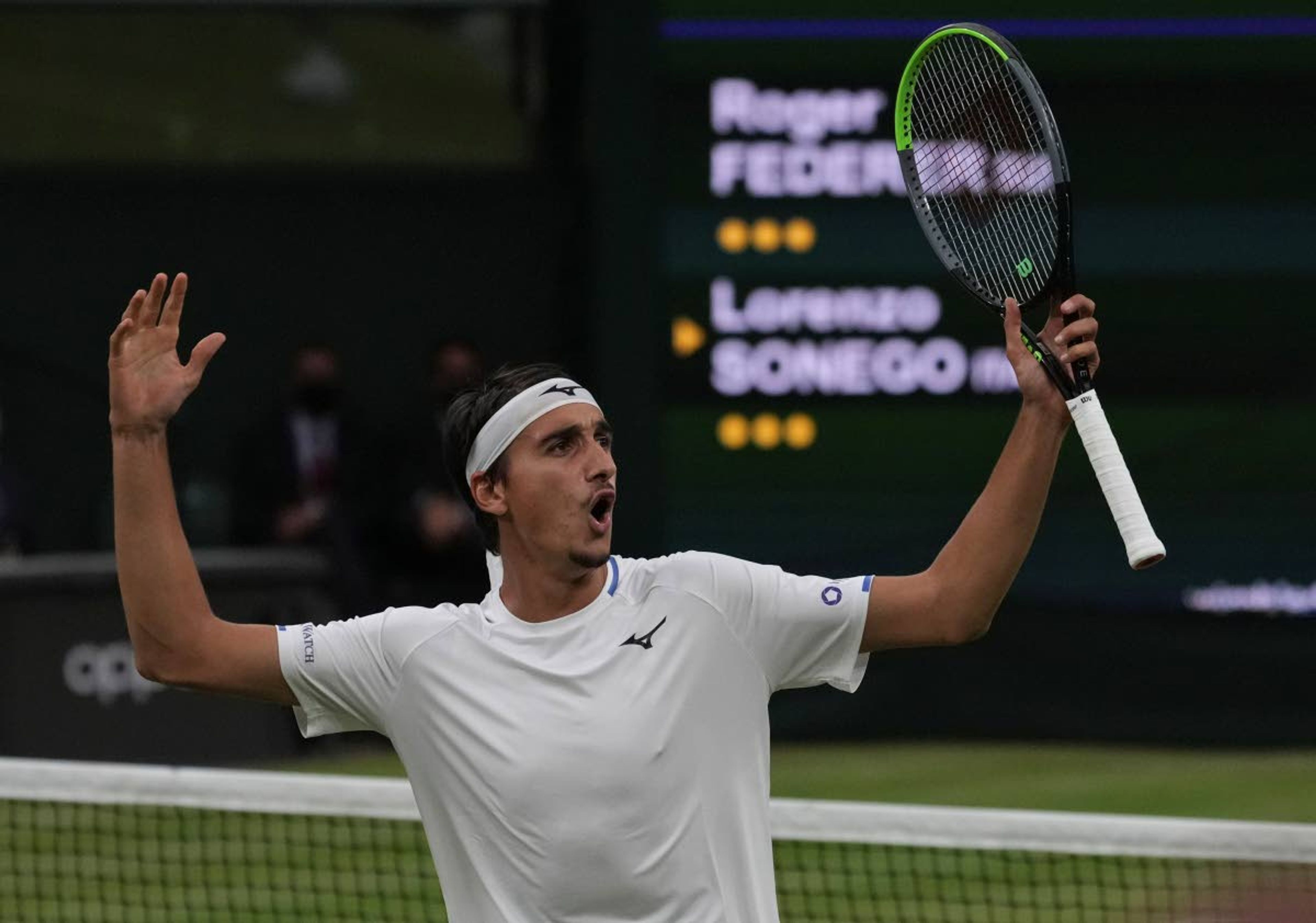 Italy's Lorenzo Sonego reacts during the men's singles fourth round match against Switzerland's Roger Federer on day seven of the Wimbledon Tennis Championships in London, Monday, July 5, 2021. (AP Photo/Alberto Pezzali)