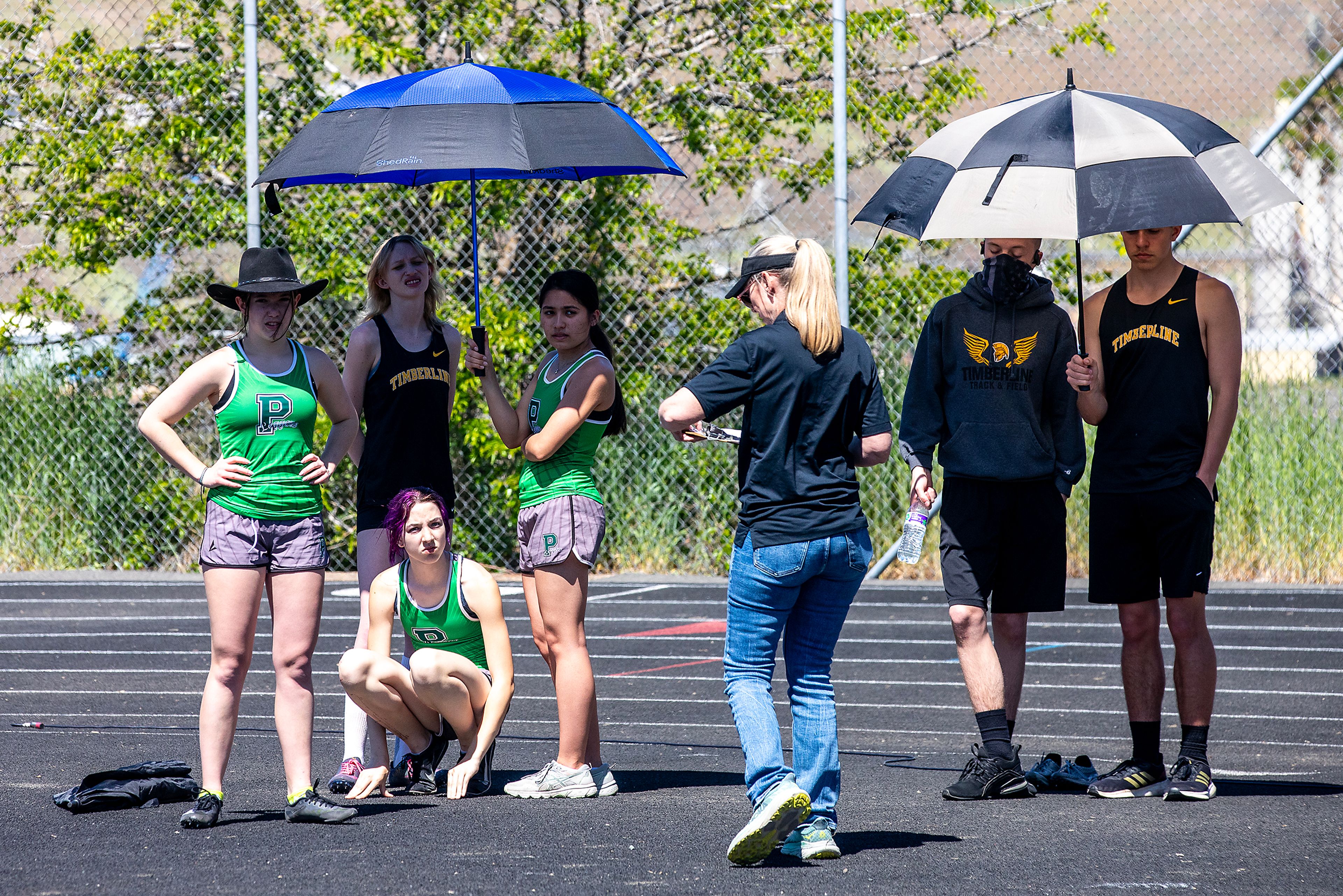 Athletes stay shaded Thursday at the Meet of Champions Track Meet at Sweeney Track and Vollmer Bowl in Lewiston.