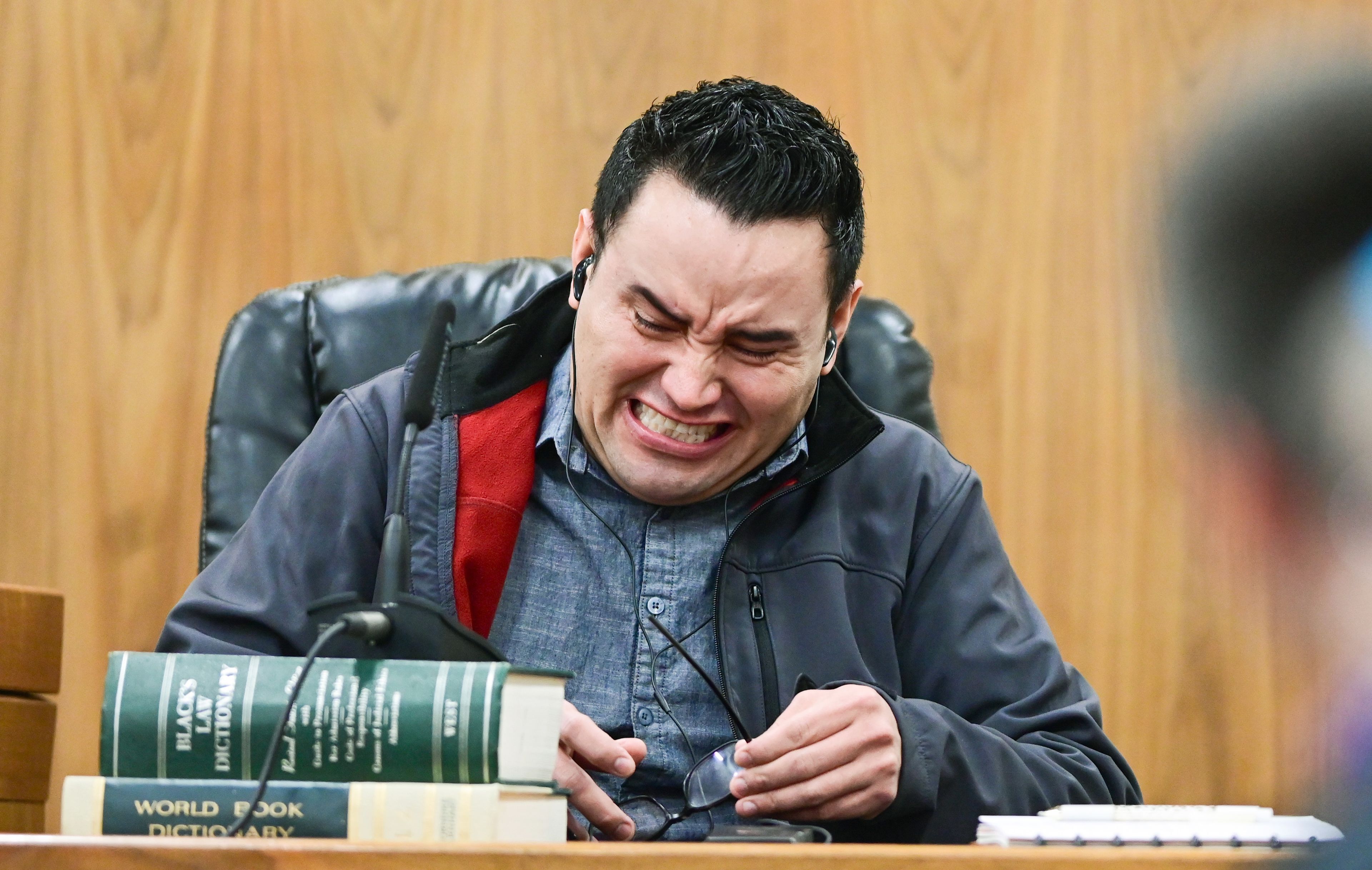 Juan Trejo Perez takes off his glasses while getting emotional giving a testimony in his felony third-degree child molestation trial in Colfax on Wednesday. Trejo Perez was found guilty by a jury, and will be sentenced at a later date.