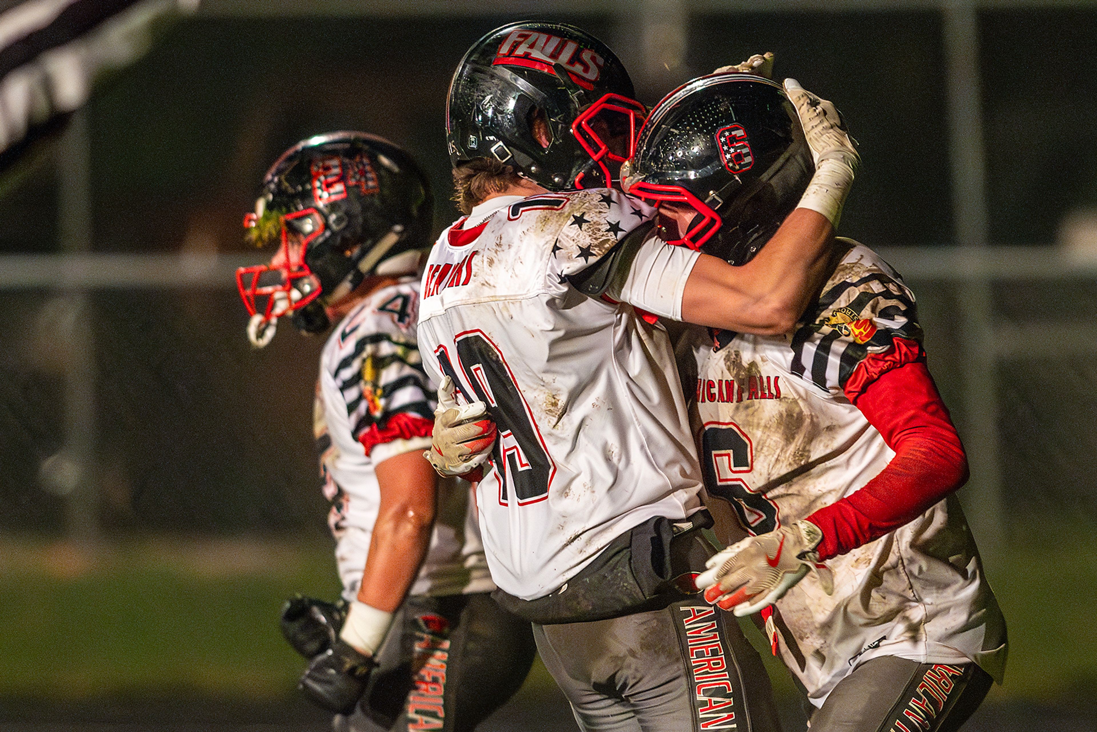 American Falls' Gavin Adamson and Zak Grigg celebrate breaking up a pass intended for Moscow wide receiver Graysen Hennrich in the end zone during an Idaho 4A playoff game Friday in Moscow.