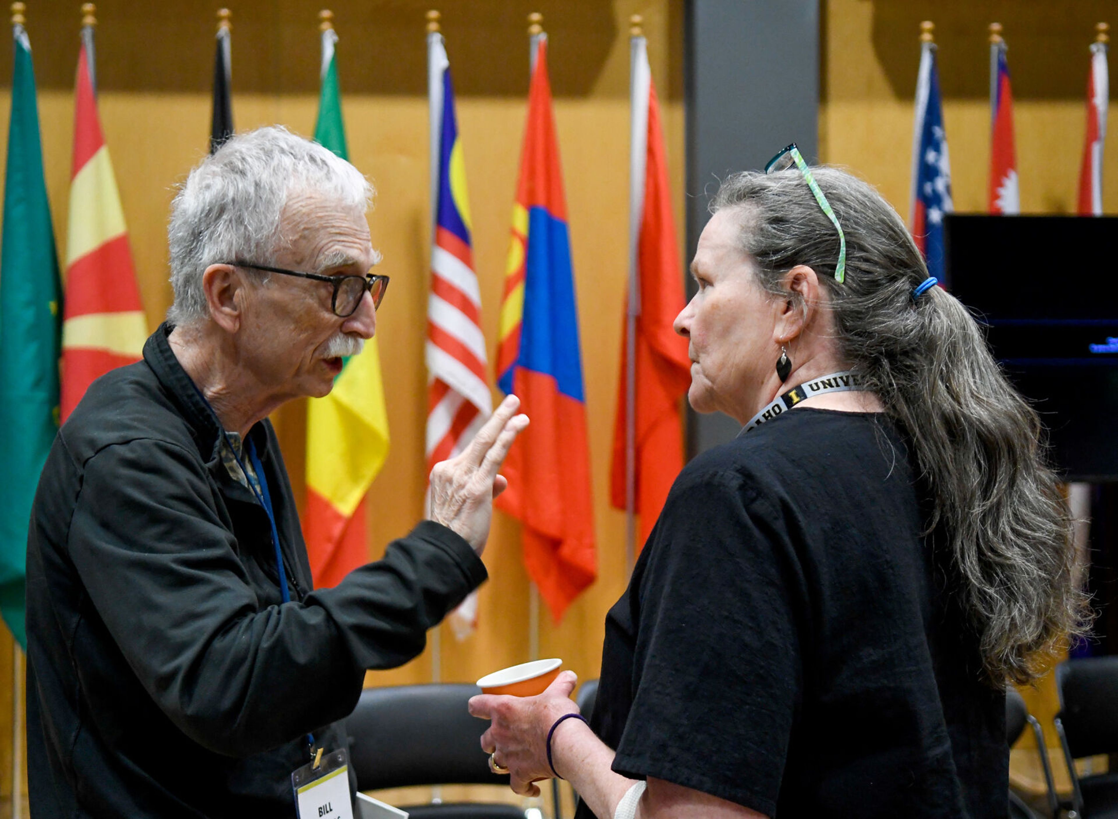 Bill Thomas, of Valley County, and Patrice Yeatter, of Idaho County, talk between sessions at the Idaho Democratic Convention on Saturday in Moscow.