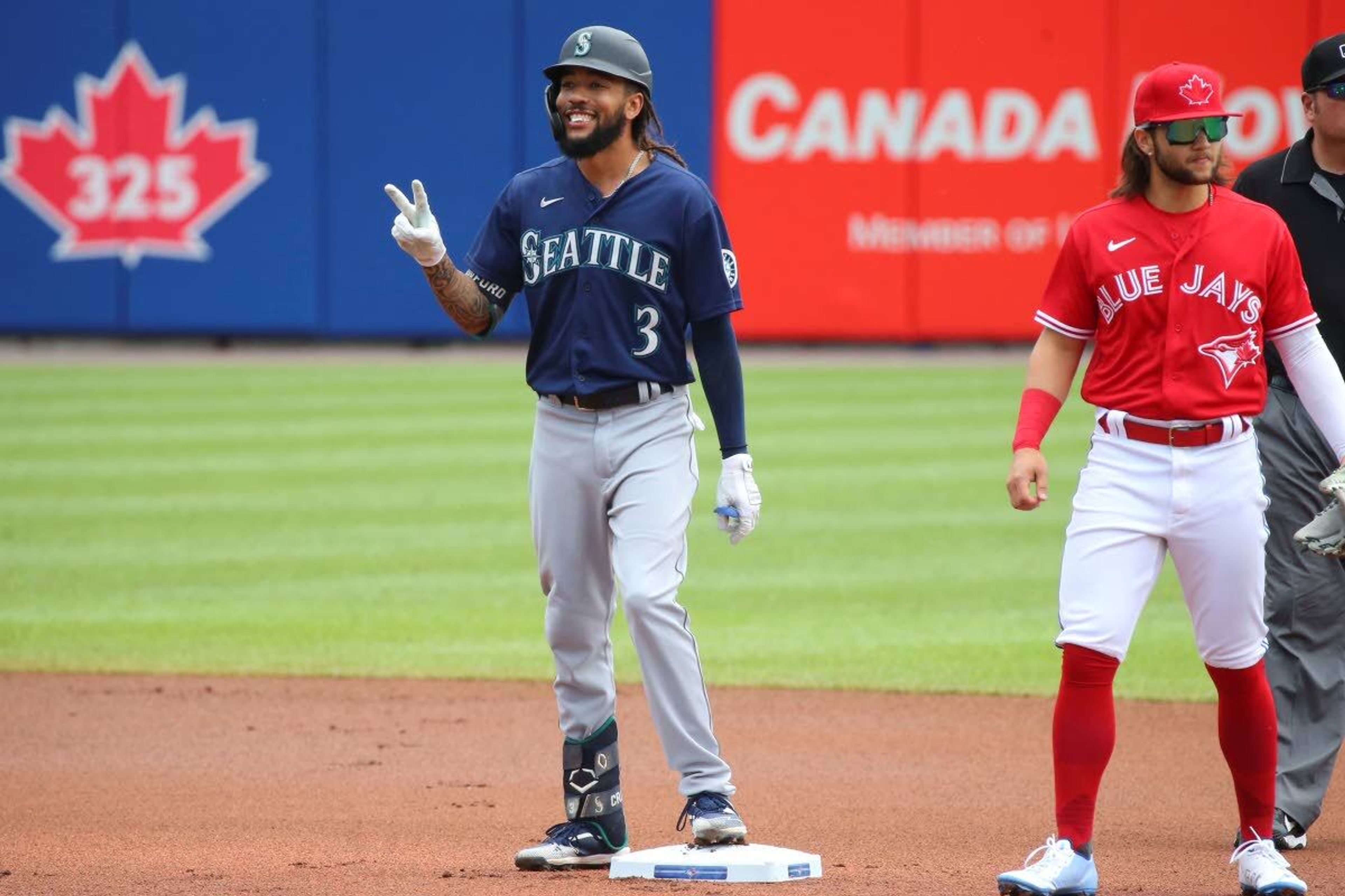 Seattle Mariners J.P. Crawford celebrates after hitting a double off Toronto Blue Jays starting pitcher Hyun Jin Ryu during the first inning of a baseball game, Thursday, July 1, 2021, in Buffalo, N.Y. (AP Photo/Jeffrey T. Barnes)