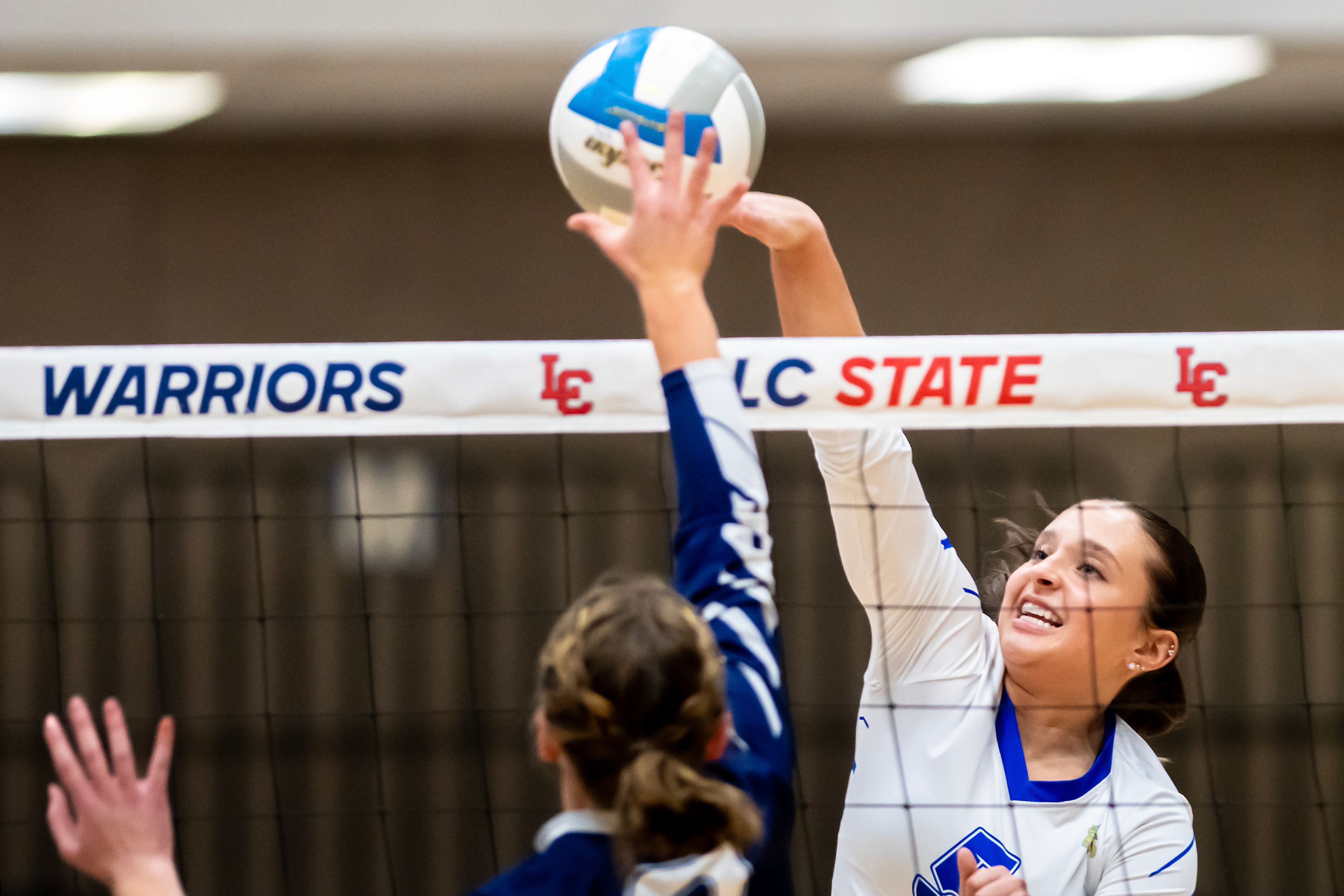 Genesee outside hitter Chloe Grieser spikes the ball against  St. John Bosco in a 1A district championship Thursday at the P1FCU Activity Center in Lewiston.,