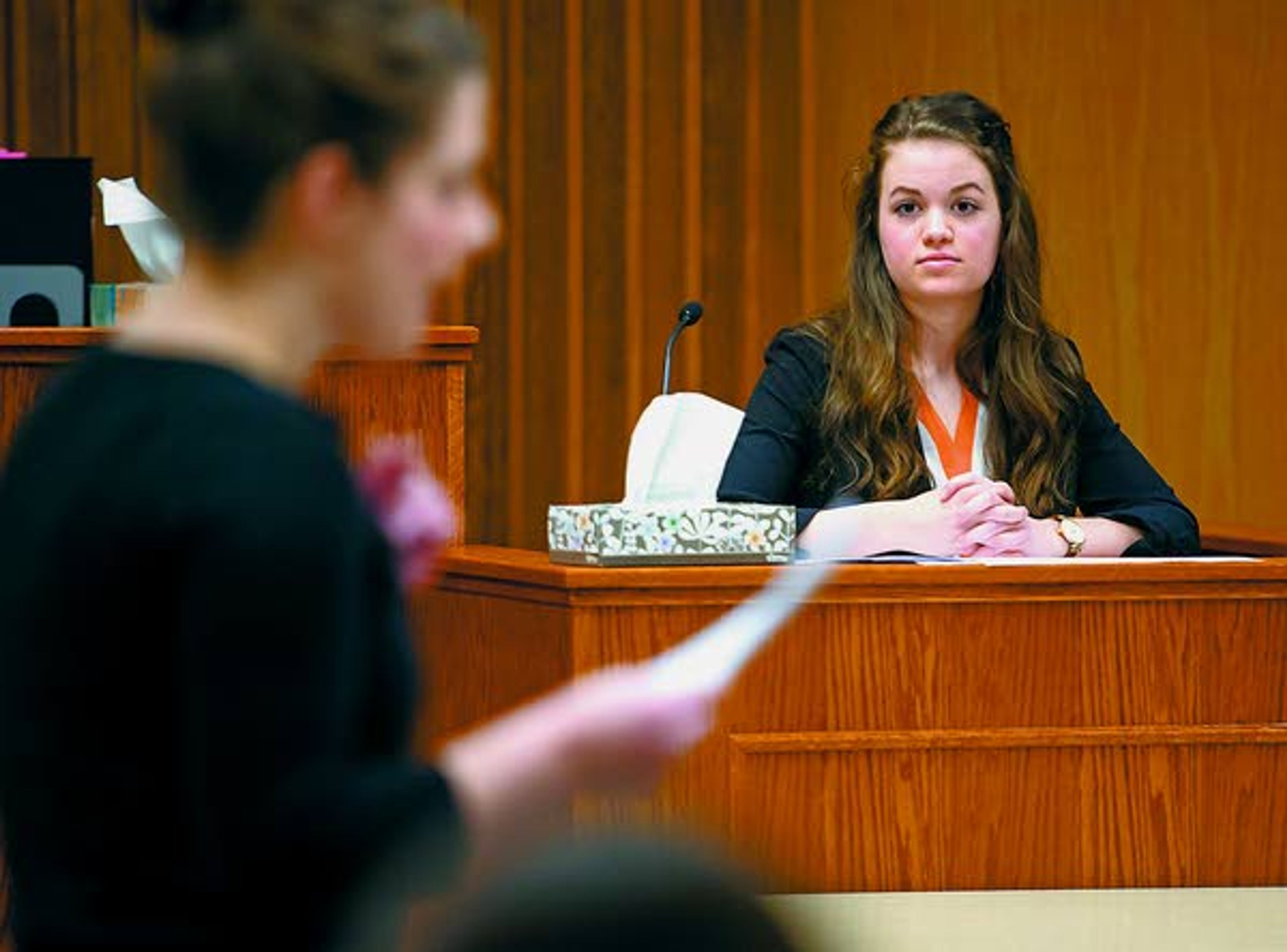 Current student Sofia Minudri, right, playing witness Tracey German (the former Twin Falls, Idaho, city manager), listens to a question posed by Maggie Church during a Logos School mock trial team scrimmage against a group of mock trial alumni on Saturday, Feb. 22, 2014, at the Latah County Courthouse. Latah County prosecutor Bill Thompson acted as judge during the scrimmage. Church is one of the Logos alumni who participated in the scrimmage.