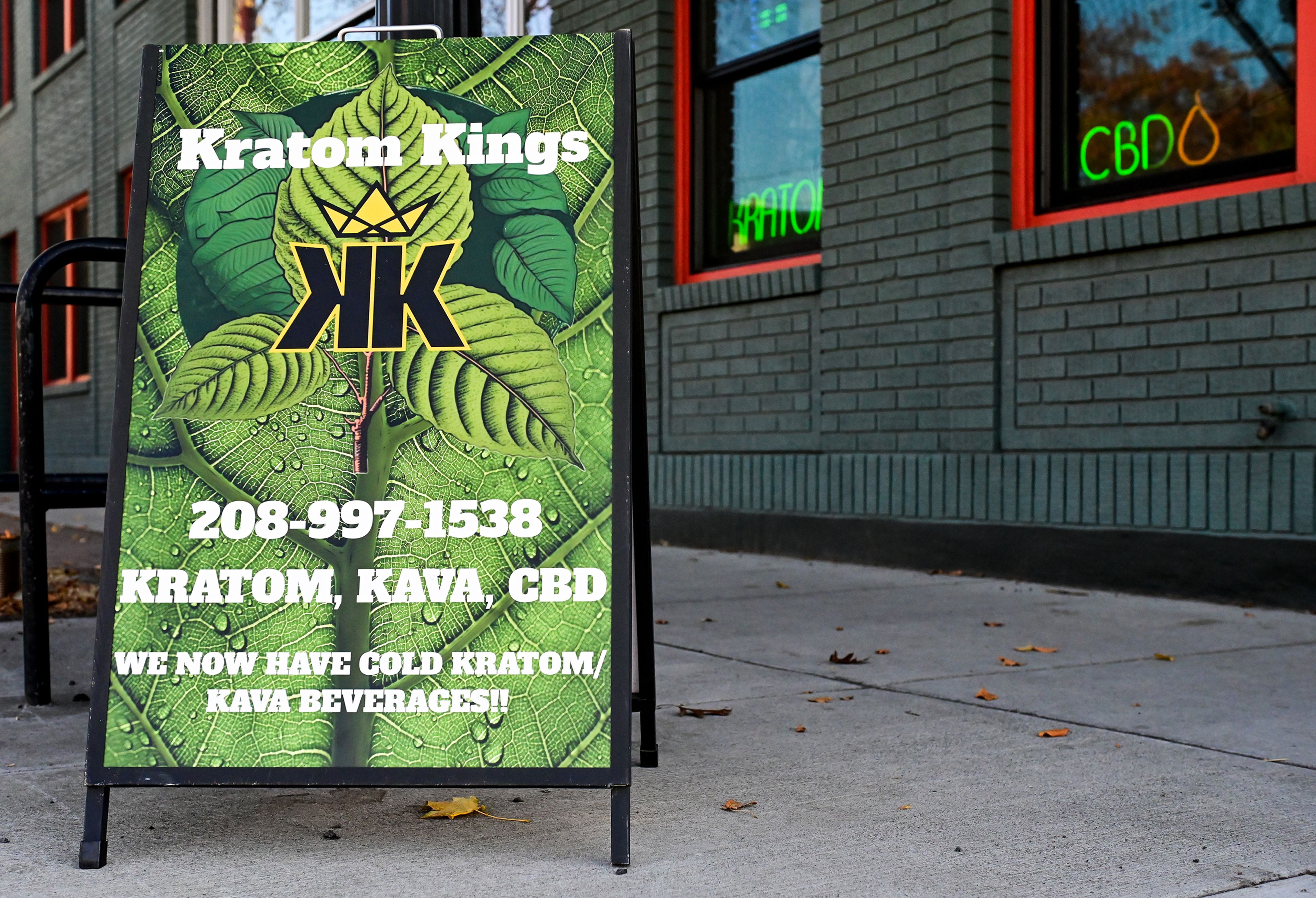 A sign advertises the products sold at Kratom Kings on Friday outside of the shop in Moscow.