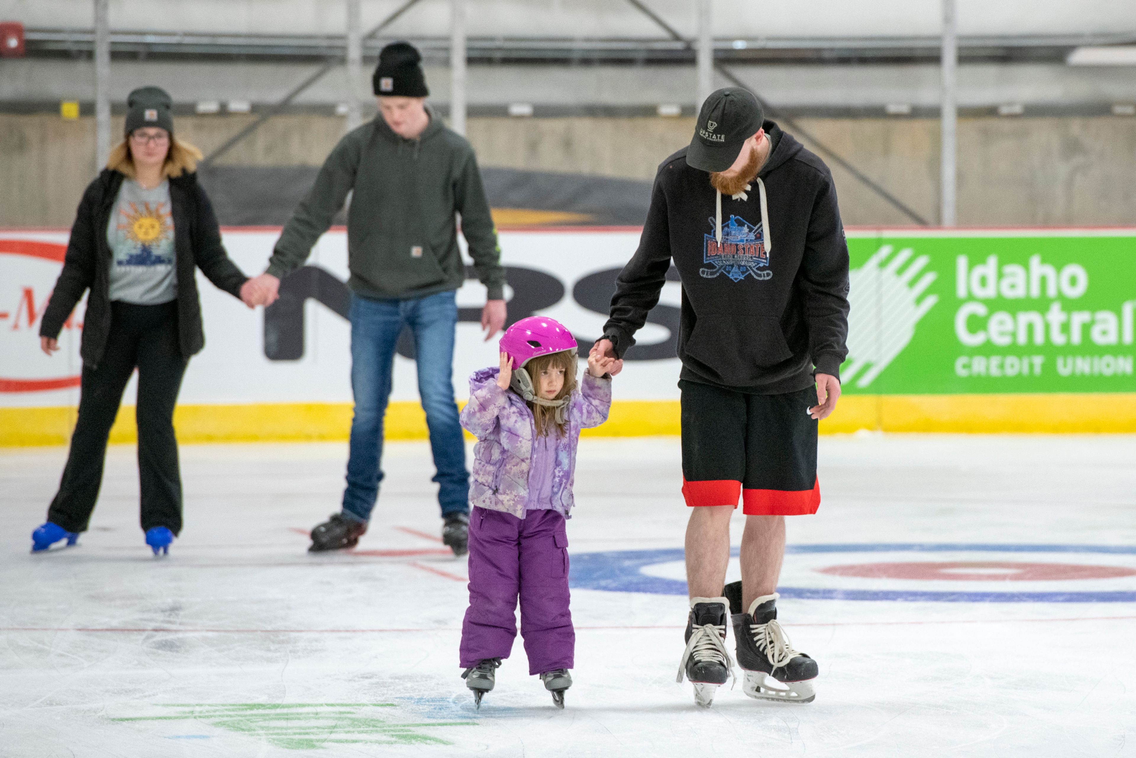 Danny Bankus skates with his sister, Tegan Norton, 4, during the opening night of the new Palouse Ice Rink in Moscow on Monday.