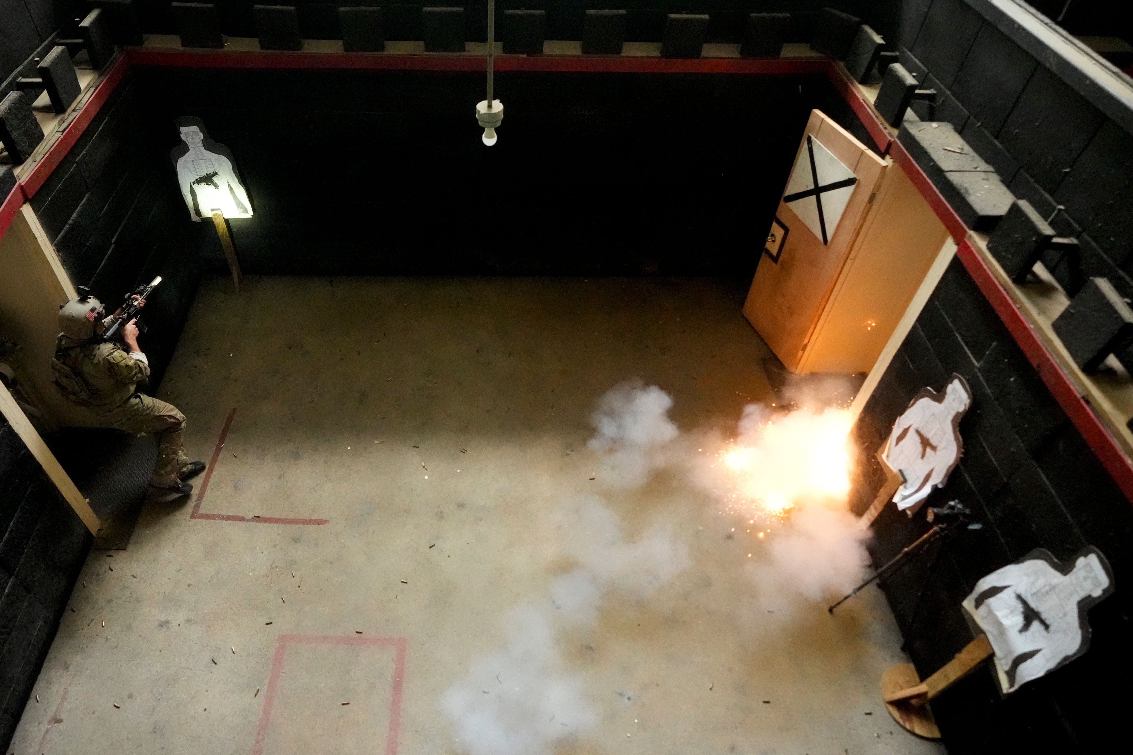 A U.S. special forces soldier sets off an explosive charge during a breaching drill, Thursday, Sept. 19, 2024, at Fort Liberty in Fayetteville, N.C. Special Operations Command is developing ways to better protect warfighters and evaluate their health risks, particularly during training. (AP Photo/Chris Carlson)