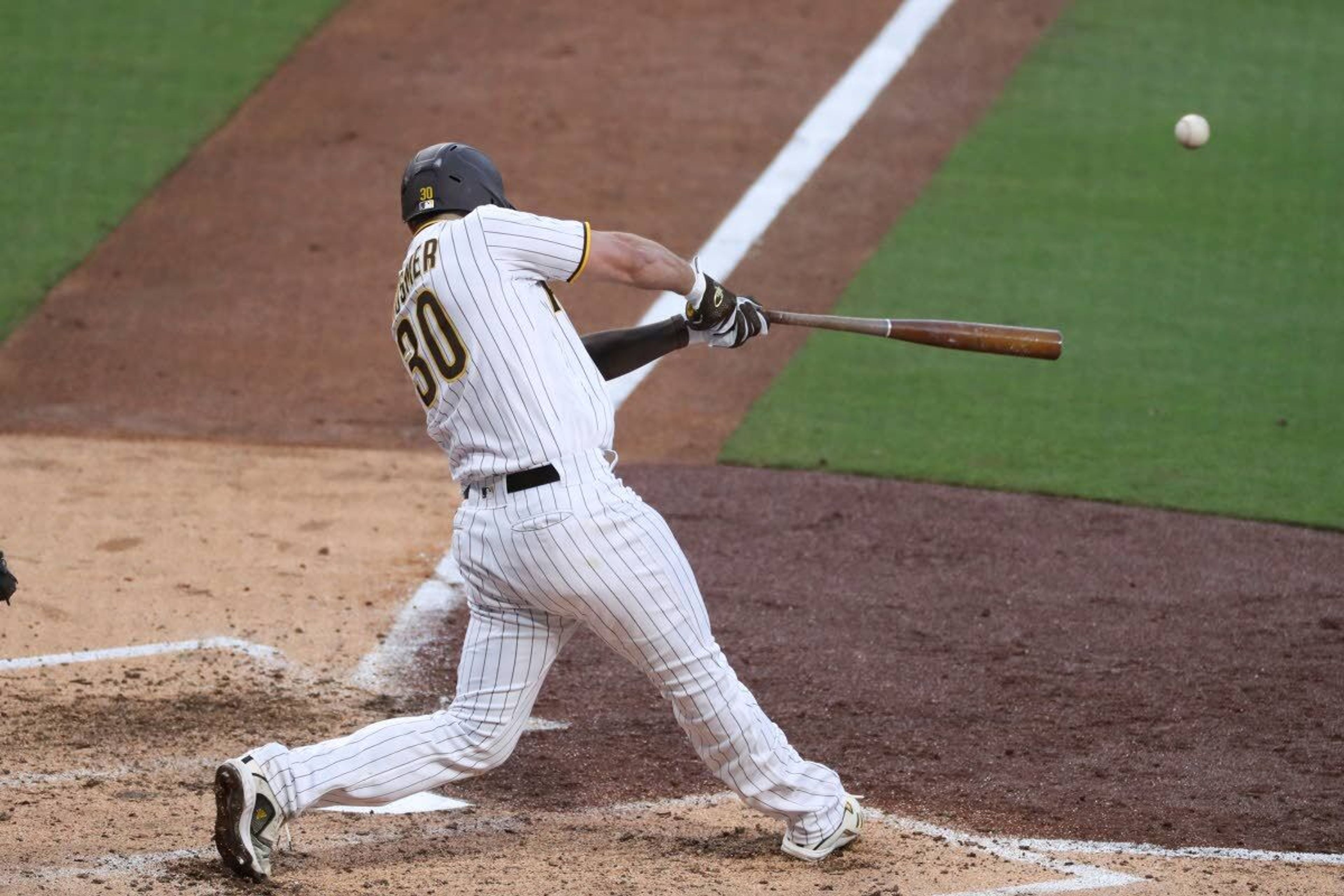 San Diego Padres' Eric Hosmer hits an RBI single to left off Seattle Mariners' Justus Sheffield during the fifth inning of a baseball game Saturday, May 22, 2021, in San Diego. (AP Photo/Derrick Tuskan)